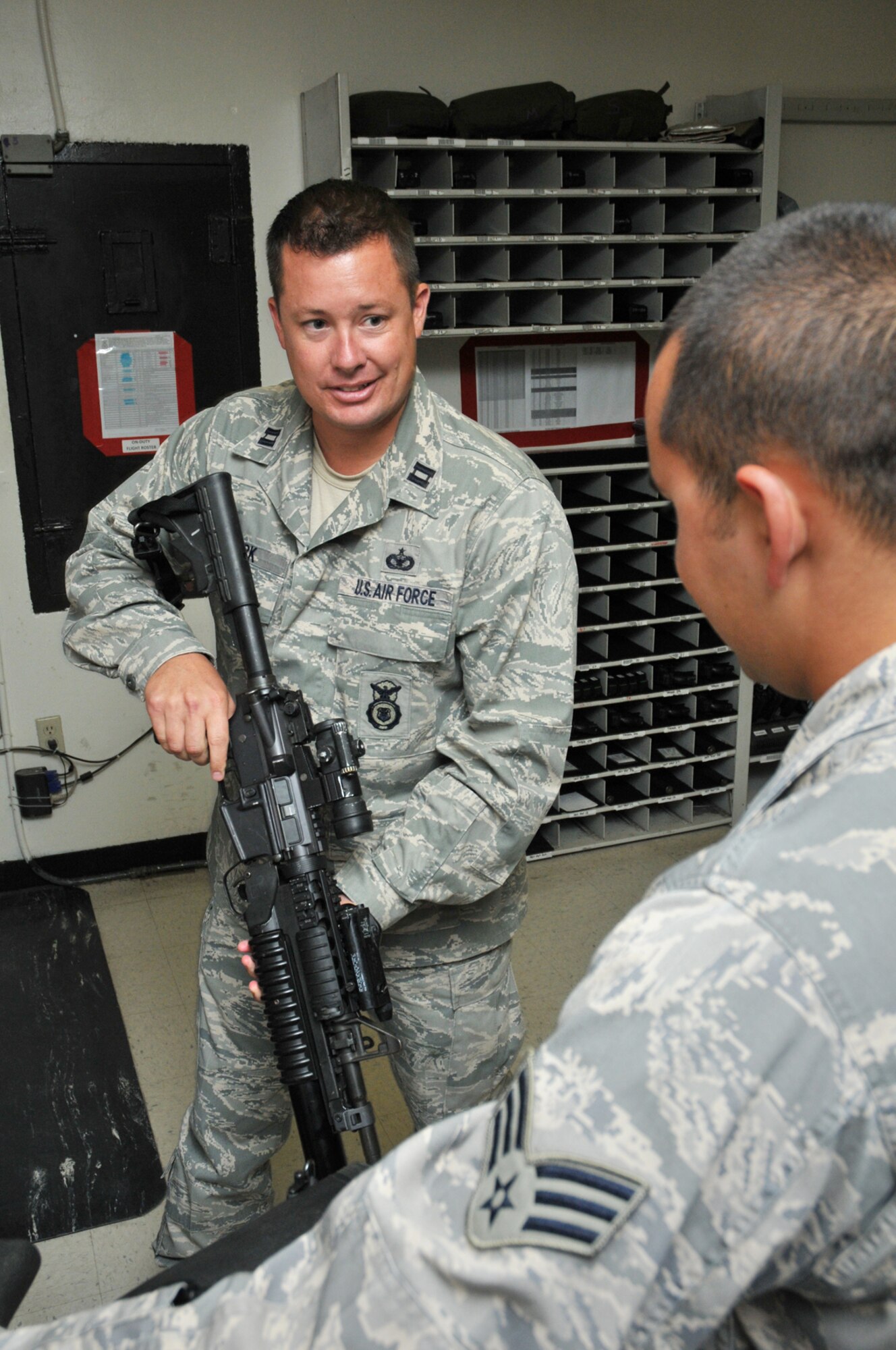 Capt. James Clark, left, gets acquainted with Senior Airman David MacDonald as he tours the armory in the 81st Security Forces Squadron Building.  Captain Clark assumed command of the 81st SFS June 9 from Capt. Jason Williams, who returns to his previous post as the squadron’s director of operations.  Captain Clark previously served as chief of integrated defense and joint basing at Hickam Air Force Base, Hawaii.  (U.S. Air Force photo by Adam Bond)
