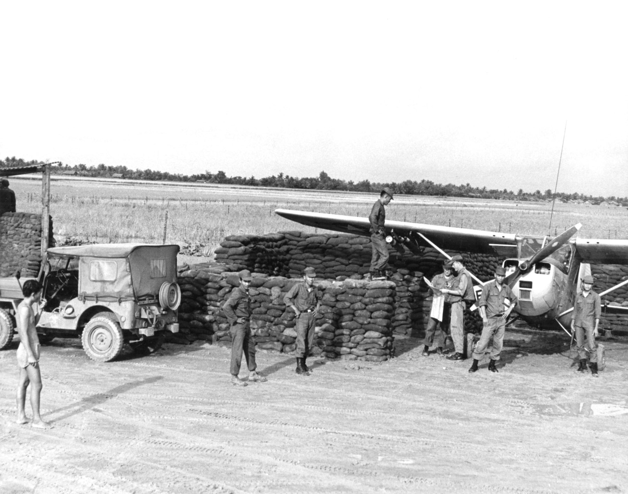 To remain in close contact with the ground forces they supported, FACs often operated from forward operating locations, like this FAC and his O-1E Bird Dog supporting Army of the Republic of Vietnam (ARVN) troops. (U.S. Air Force photo)