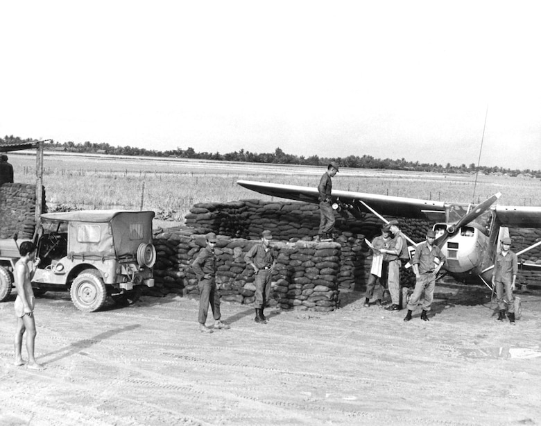 To remain in close contact with the ground forces they supported, FACs often operated from forward operating locations, like this FAC and his O-1E Bird Dog supporting Army of the Republic of Vietnam (ARVN) troops. (U.S. Air Force photo)