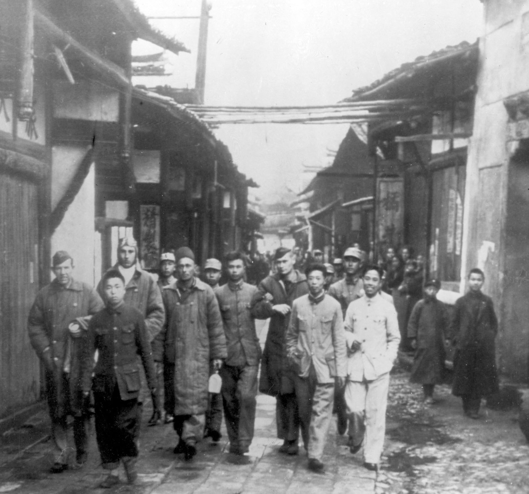 Pictured shortly after the raid (l to r) are Lt Herb Macia, Lt Jack Sims, Sgt Jacob Eierman, and Maj John Hilger alongside Chinese villagers who risked their lives to help them.  It is estimated that Japanese forces executed as many as 250,000 Chinese in retaliation for the raid and subsequent Chinese assistance to the Raiders.(U.S. Air Force photo)
