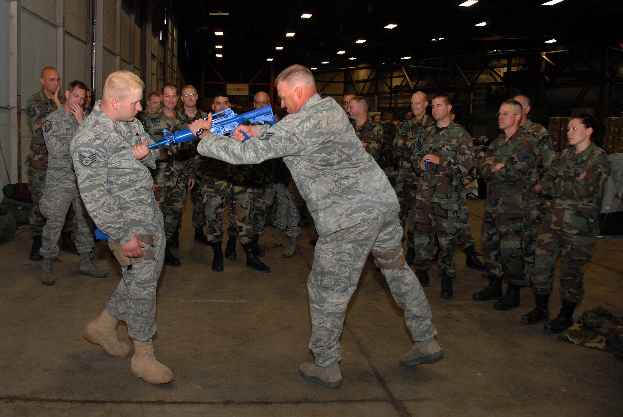 Staff. Sgt Roger Torgeson and Staff Sgt. Randall Fischer of the 137th Space Warning Squadron demonstrate effective defensive and offensive rifle techniques June 10, 2009, Ellsworth Air Force Base, South Dakota.  Members of the 137th SWS located in Greeley Colorado, are participating in several training events while at Ellsworth AFB this week to further enhance their one of a kind worldwide capable mission as a missile warning , space launch and detection mobile unit. (U.S Air Force photo by: Tech. Sgt. Wolfram M. Stumpf/Released)