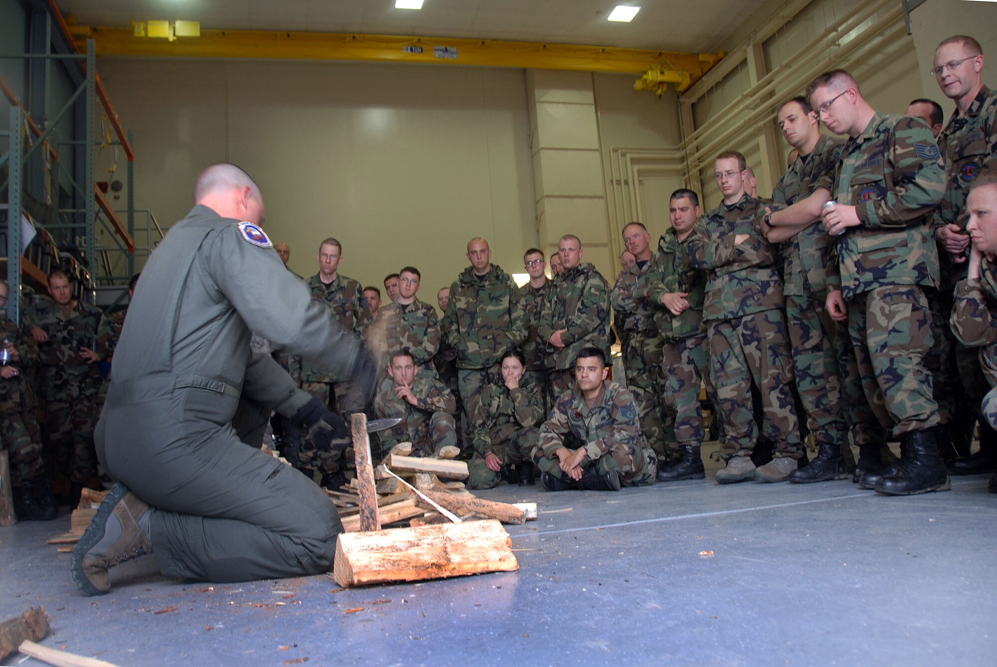 Tech. Sgt. Kenneth Walter a 28th Operations Support Squadron/SERE (Survival, Evasion, Resistance & Escape) Instructor, demonstrates how to safely cut up wood for the use of a fire to members of the 137th Space Warning Squadron, June 9, 2009 at Ellsworth Air Force Base, South Dakota.  Members of the 137th SWS located in Greeley Colorado, are participating in several training events such as SERE training while at Ellsworth AFB this week to further enhance their one of a kind worldwide capable mission as a missile warning , space launch and detection mobile unit. (U.S Air Force photo by: Tech. Sgt. Wolfram M. Stumpf/Released)