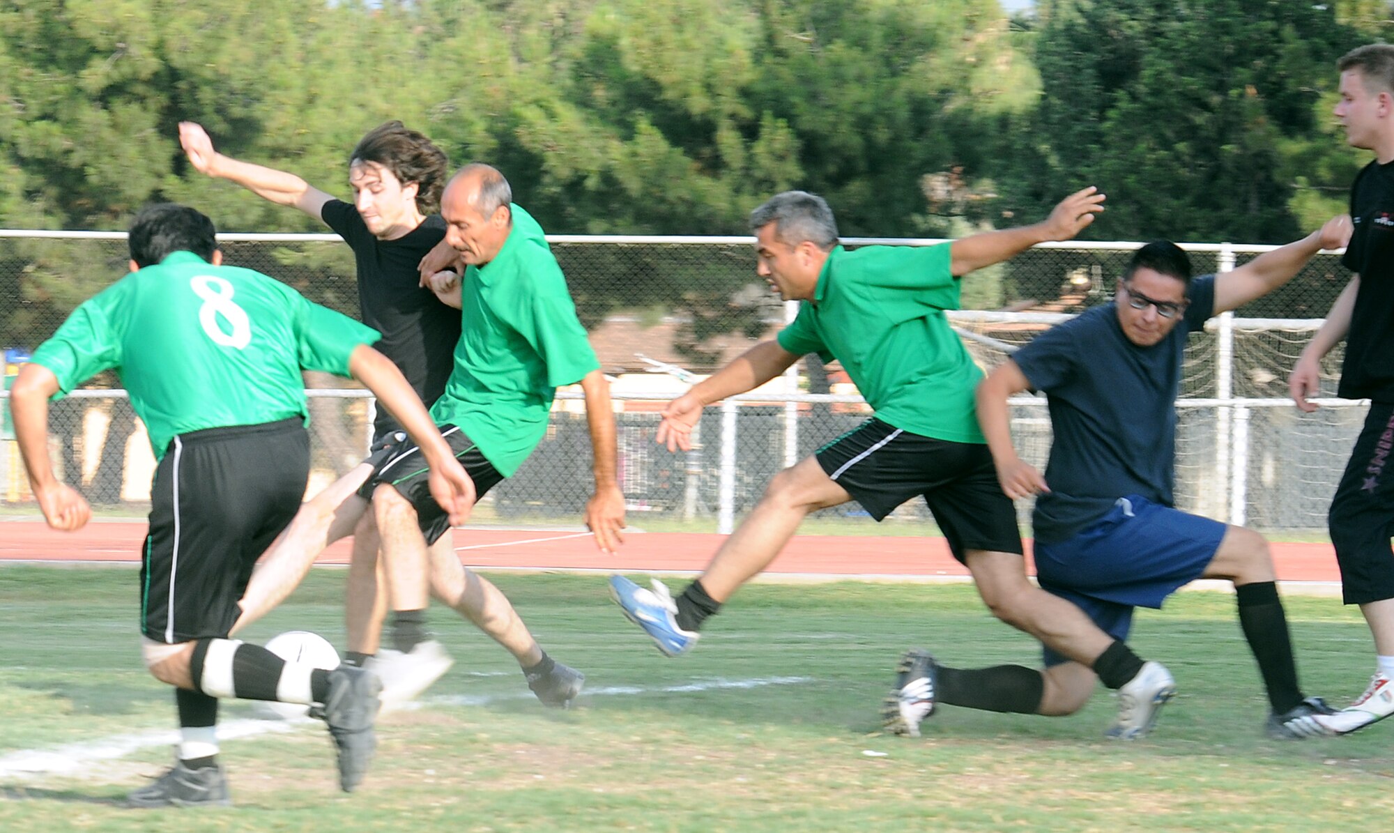 Players from the 39th Civil Engineer Squadron and 39th Operations Squadron clash while trying to retrieve the ball during the intramural soccer championship game Tuesday, June 16, 2009, Incirlik Air Base, Turkey. The 39th CES won the game 3-0. The teams played each other June 15, and due to a 39th CES win, an additional game needed to be played to determine the winner. (U.S. Air Force photo/Airman 1st Class Alex Martinez)