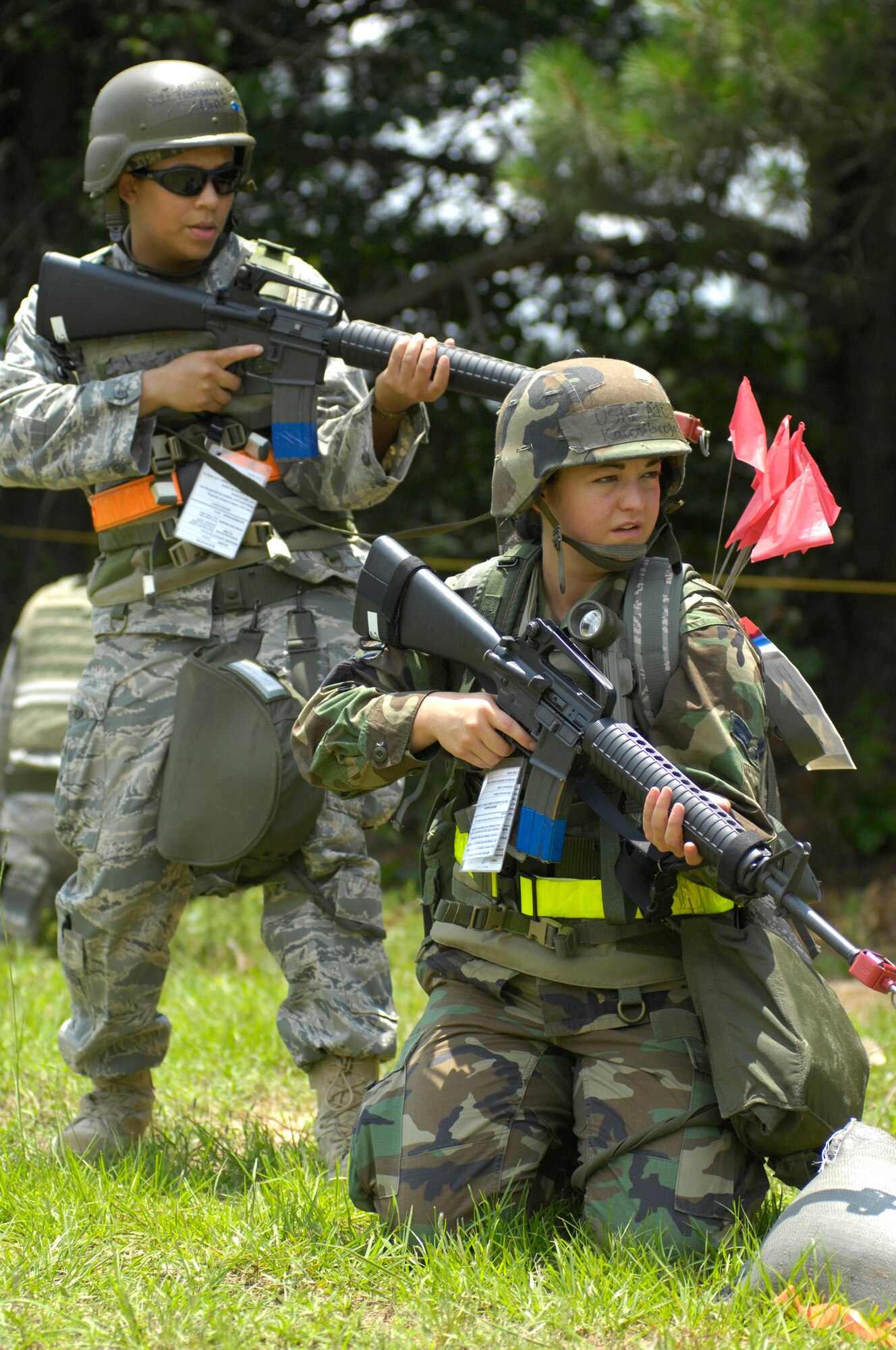 SHAW AIR FORCE BASE, S.C. -- Airmen 1st Class Yesenia Fernandez, left, and Kacee Gregory, both 20th Civil Engineer Squadron, look for opposing forces during Team Shaw's operational readiness inspection, June 15. Fernandez and Gregory will help their team clear the area of opposing forces so a secure cantonment area can be set up. The ORI will evaluate the training and preparedness of Shaw Airmen for homeland attack and worldwide deployment. (U.S. Air Force photo/Senior Airman Kathrine McDowell)
