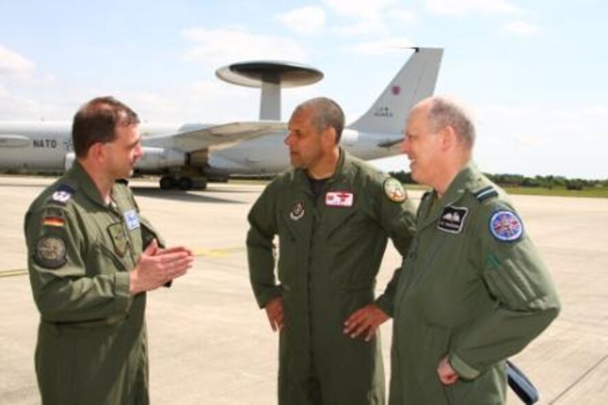Colonel Joe Dill, 420th Air Base Group commander at RAF Fairford, with a German NATO E-3A AWACs pilot Lt. Col. Hans Grunwald and Royal Air Force Air Commodore Dai Whittingham, Deputy Commander NATO Airborne Early Warning and Control Force, at the launch of the Royal International Air Tattoo, Europe's largest airshow scheduled for July 18-19 at Fairford.

The NATO E-3A AWACs, from Geilenkirchen, Germany, was taking part in the launch on June 3 to highlight the Air Tattoo's planned tribute to NATO on its 60th anniversary.
Also taking part in the launch were an RAF Nimrod from RAF Kinloss in Scotland and an RAF Search and Rescue Sea King Helicopter, reflecting the maritime theme at this summer's airshow.
