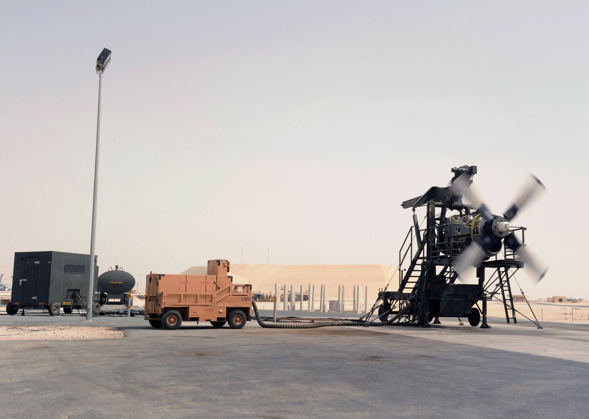 The Propulsion Flight from the 379th Expeditionary Maintenance Squadron runs a serviceability test on a C-130H Hercules engine using the new T56 engine test cell, June 14, 2009, in an undisclosed location in Southwest Asia.  The new test cell is the only one in the U.S. Central Command's area of responsibility, which allows engine tests to be carried out here in the AOR instead of going back to Ramstein AB, Germany. All members of the 379 EMXS are deployed in Support of Operations Iraqi and Enduring Freedom and Combined Joint Task Force - Horn of Africa.  (U.S. Air Force Photo by Staff Sgt. Joshua Garcia/released)