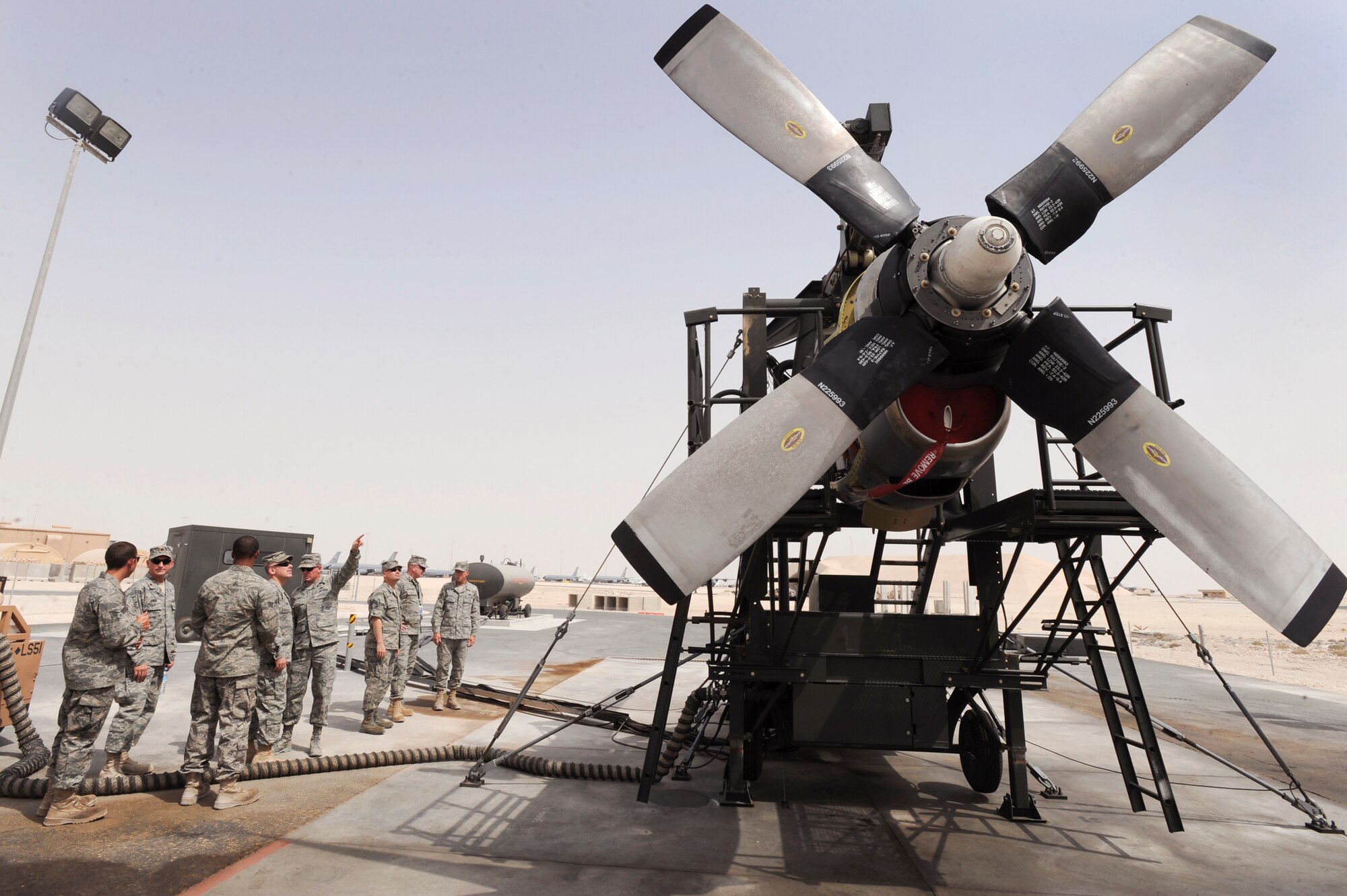 379th Expeditionary Maintenance Group leadership gets briefed on the new T56 engine test cell prior to a demonstration of its capability, June 14, 2009, in an undisclosed location in Southwest Asia.  The test cell is the only T56 testing rig in the U.S. Central Command's area of responsibility, which allows engine tests to be carried out here in the AOR instead of going back to Ramstein AB, Germany.  All members are deployed in support of Operations Iraqi and Enduring Freedom and Combined Joint Task Force ? Horn of Africa. (U.S. Air Force Photo by Staff Sgt. Joshua Garcia/released) 