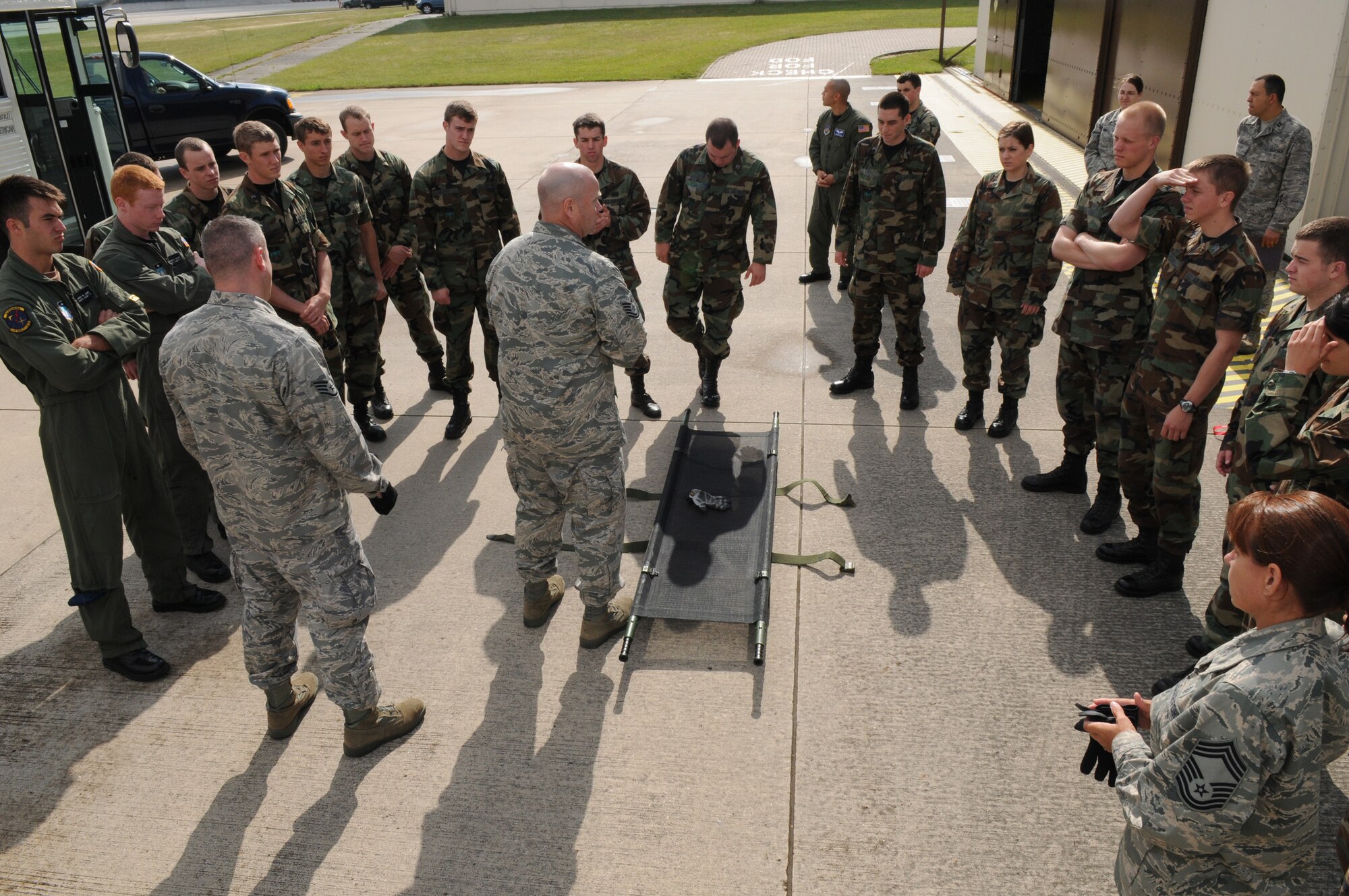 U.S. Air Force Tech. Sgt. Scott Davison, a Contingency Aeromedical Staging Facility medic, briefs U.S. Air Force Academy cadets on proper procedures of transporting patients using a litter, Ramstein Air Base, Germany, June 16, 2009.  The cadets are participating in Operation Air Force, a summer program which provides exposure to real-world Air Force base environments and prepares the cadets for the transition from academy life to active duty.  (U.S. Air Force photo by Staff Sgt. Chenzira Mallory)