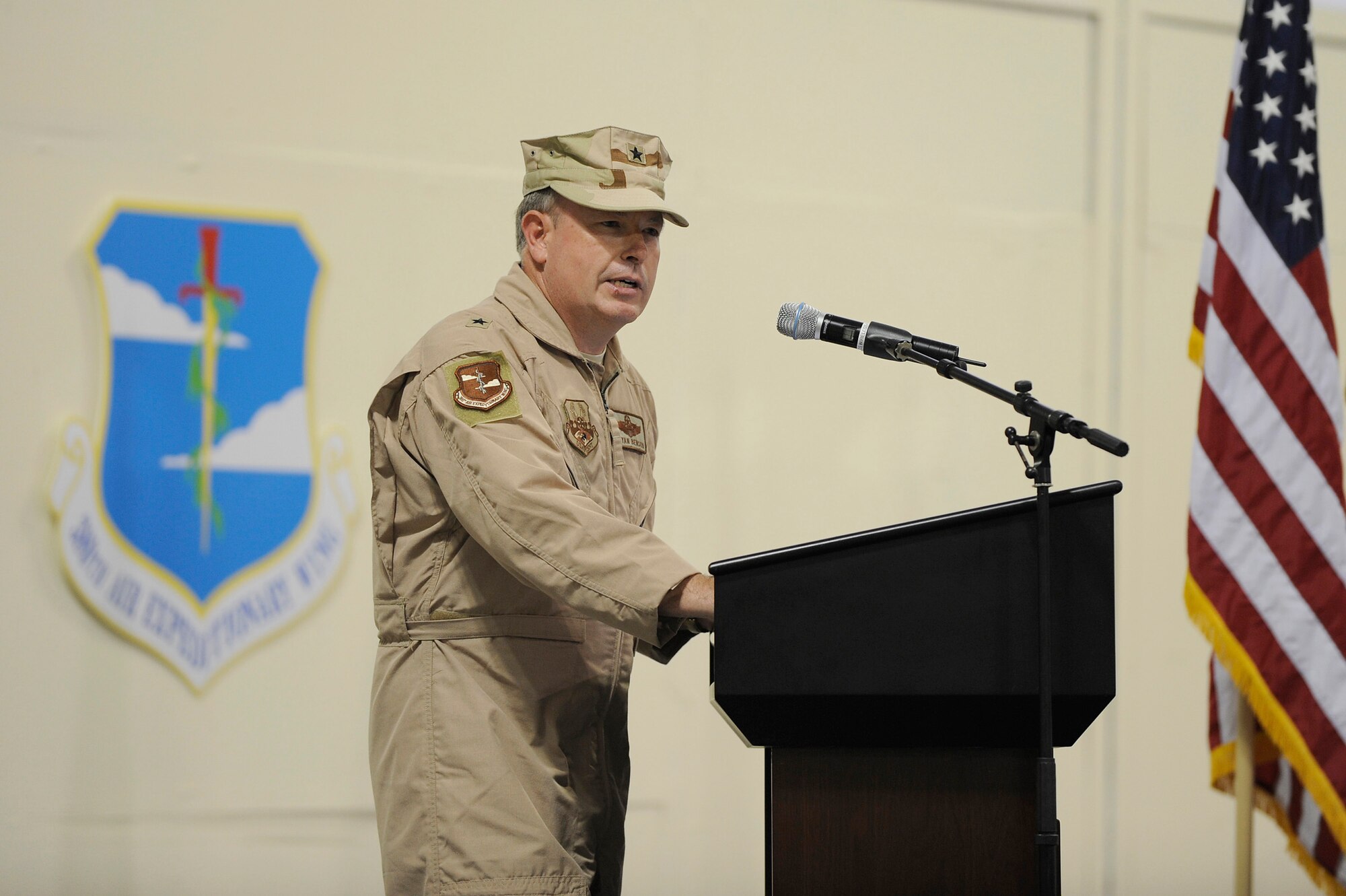 SOUTHWEST ASIA - Brig. Gen. Bryan Benson, commander, 380th Air Expeditionary Wing makes his first speech to Airmen of the 380th AEW after taking command during a ceremony, June 14 at an undisclosed location in Southwest Asia. General Benson comes from Scott AFB, Ill. as the vice commander for the 618th Tanker Airlift Control Center, to lead the Airmen of the 380th AEW. (U.S. Air Force photo by Senior Airman Brian J. Ellis) (Released)