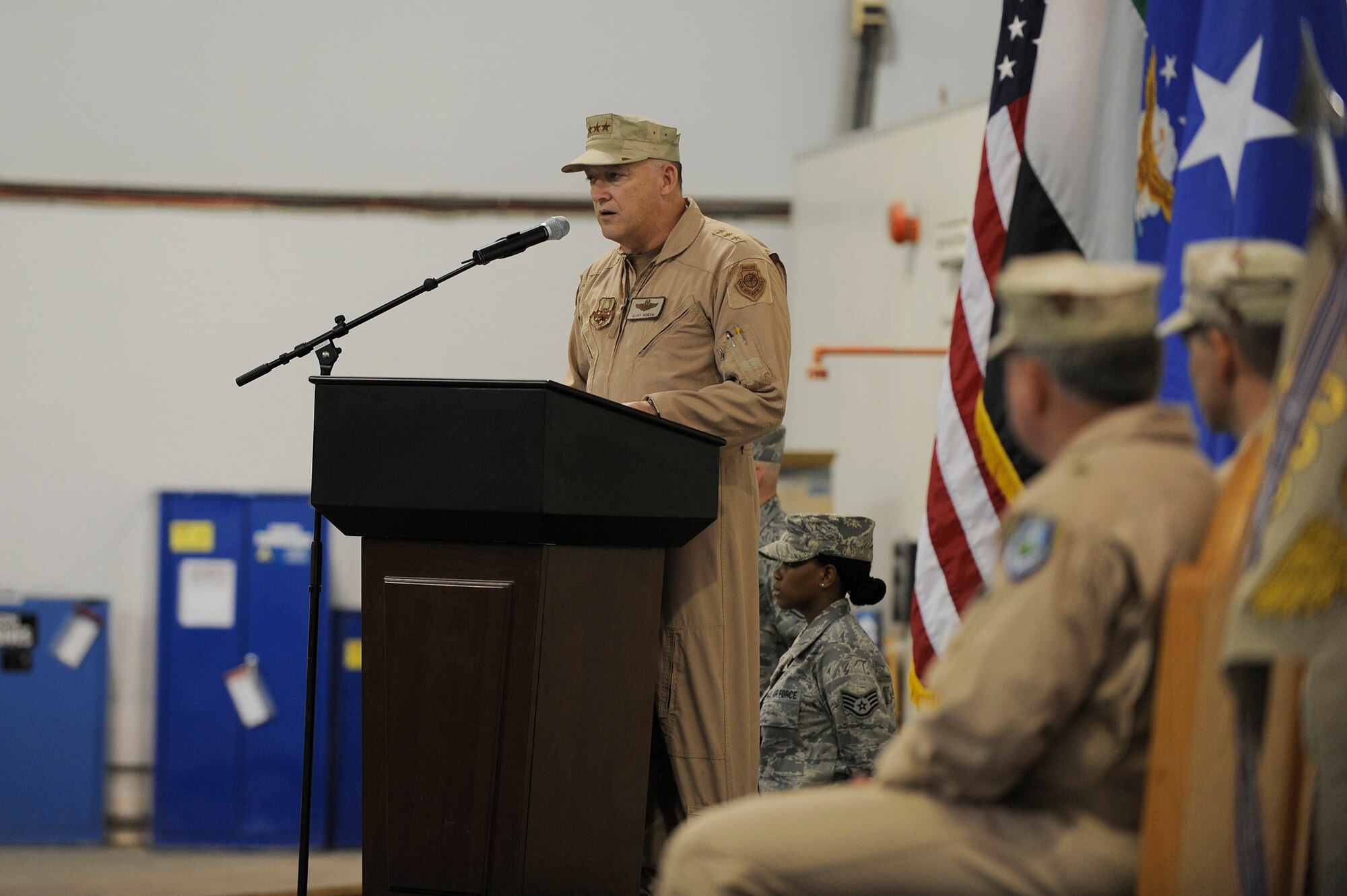SOUTHWEST ASIA - Lt. Gen. Gary North, commander, U.S. Air Forces Central, gives a speech before presenting command of the 380th Air Expeditionary Wing to Brig. Gen. Bryan Benson at a change of command ceremony, June 14 at an undisclosed location in Southwest Asia. General Benson comes from Scott AFB, Ill. as the vice commander for the 618th Tanker Airlift Control Center, to lead the Airmen of the 380th AEW. (U.S. Air Force photo by Senior Airman Brian J. Ellis) (Released)