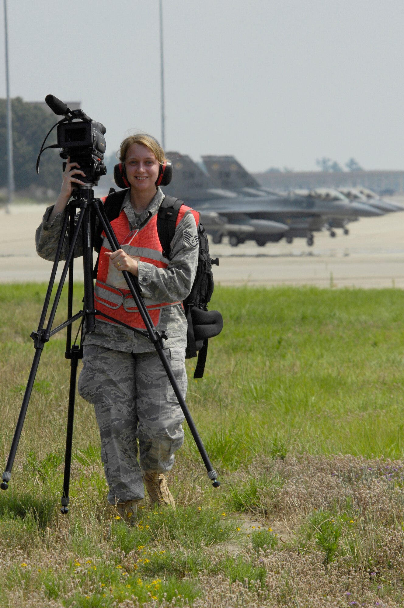 SHAW AIR FORCE BASE, S.C. -- Staff Sgt. Genevieve Armstrong, 20th Fighter Wing Public Affairs broadcaster, takes her gear to a video shoot on the flightline during Team Shaw's operational readiness inspection, June 16. The ORI will evaluate Shaw's ability to survive and operate in combat conditions. (U.S. Air Force photo/Senior Airman Kathrine McDowell)