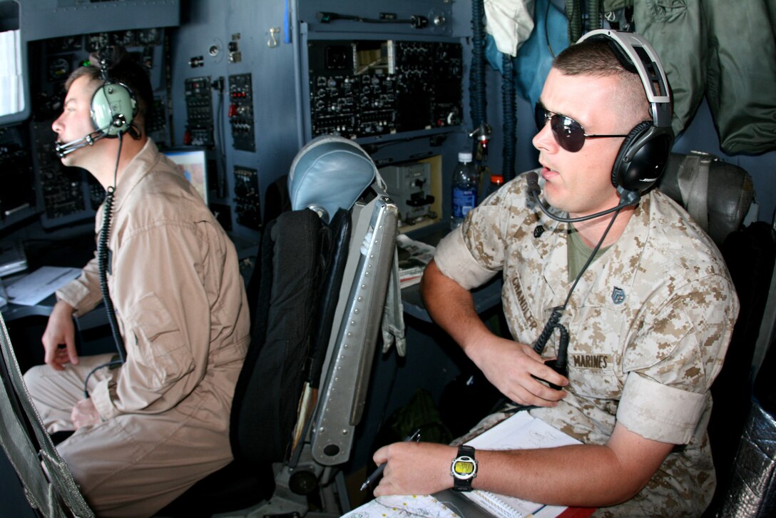 Staff Sgt. Tim Chandler, an air support operations instructor based at the Marine Corps Air Ground Combat Center in Twentynine Palms, Calif., conducts airborne radio relay from the cockpit of a KC-130 aircraft between Marine Forces Reserve units on the ground and CH-46 helicopters during a casualty evacuation training exercise which took place at the Marine Corps Mountain Warfare Center in Bridgeport, Calif., Naval Air Station Fallon, Nev. and Hawthorne Army Depot, Nev. June 17. Chandler, a Yoncalla, Ore. native, was based out of Fallon with his detachment of air support controllers June 13 - 19 to support Marine Forces Reserve units in Javelin Thrust 2009. This large-scale exercise was conducted at six bases in three states to prepare reserve units for their future role in deployed Marine Air Ground Task Forces.