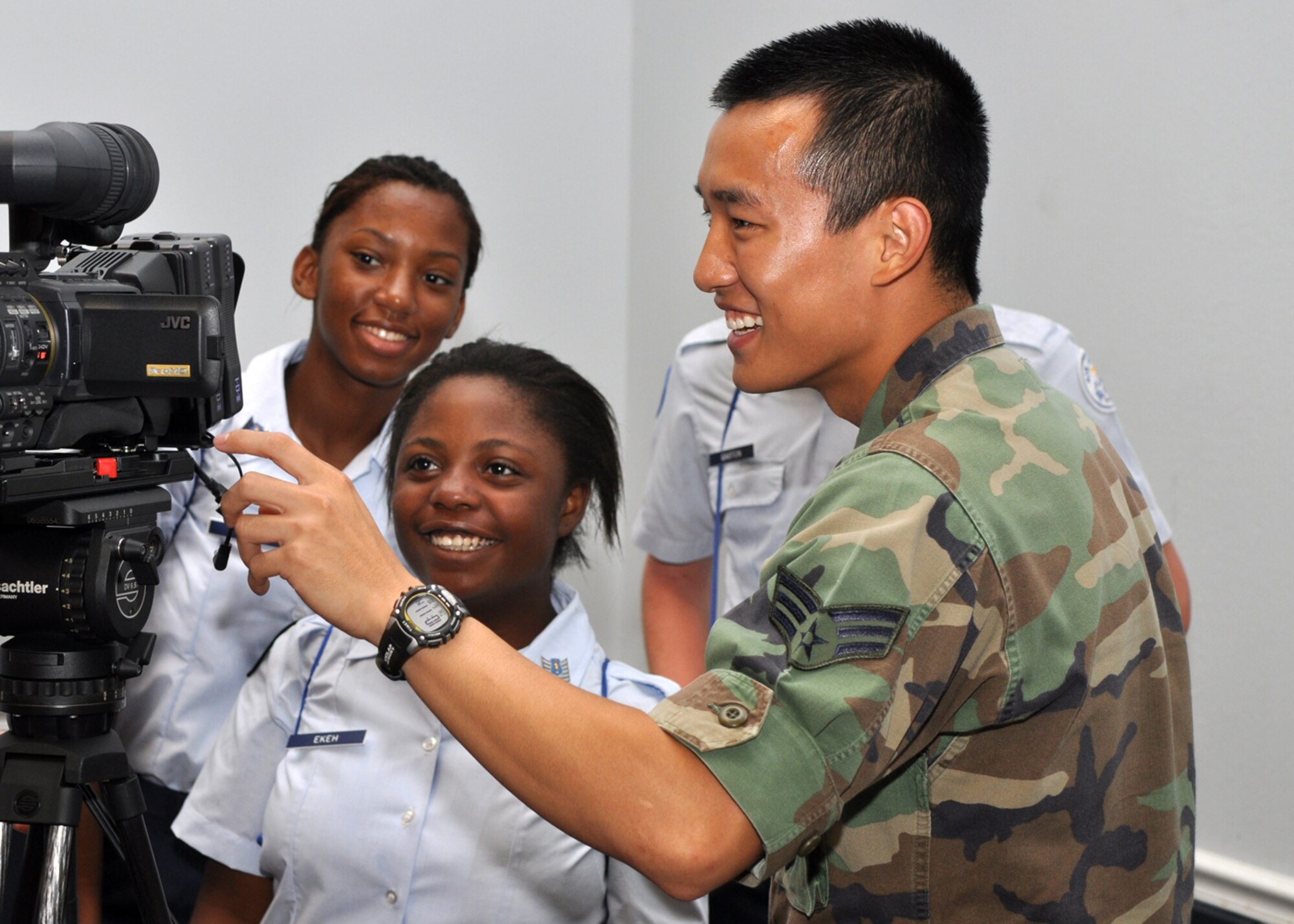 Air Force Junior Reserve Officers’ Training Corps Cadet Tydra Ekeh gets a hands-on lesson from Senior Airman David Zheng, 2nd Bomb Wing, combat correspondent, about video broadcasting in Hoban Hall at Barksdale Air Force Base, La., June 18, 2009, as part of an eight-day “Summer Leadership School” more than 300 JROTC cadets are attending. Cadet Ekeh is a member of the AF JROTC Unit at West Jefferson High School in Harvey, La. The eight-day school is designed to encourage each cadet’s leadership skills. The cadets are chosen for the school by unit officials after they pass certain criteria. Cadets must also maintain a “C” average in high school. The JROTC motto is “Building Citizenship and Character in the Youth of America.” (U.S. Air Force photo/Tech. Sgt. Jeff Walston)