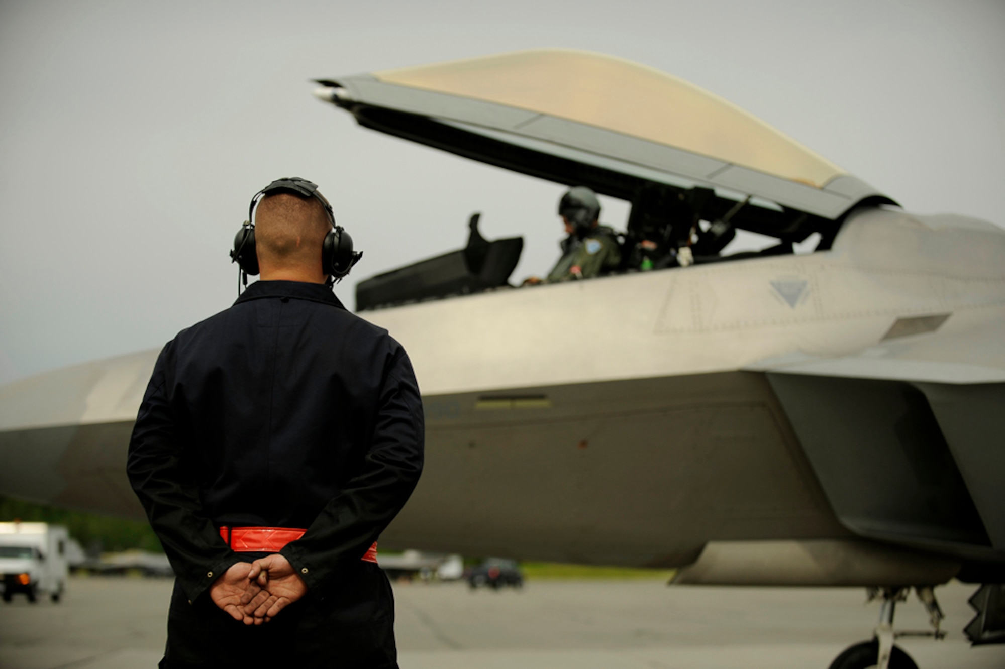 Airman 1st Class Holden Coladonato from the 90th Fighter Squadron, Elmendorf AFB, Alaska, prepares a F-22 Raptor for take off during exercise Northern Edge 2009, Elmendorf AFB, Alaska, June 17, 2009.  Northern Edge 2009 is Alaska's largest military training exercise.  It prepares joint forces to respond to crises throughout the Asia-Pacific region.  (Released/U.S. Air Force photo by TSgt Dennis J. Henry Jr.)
