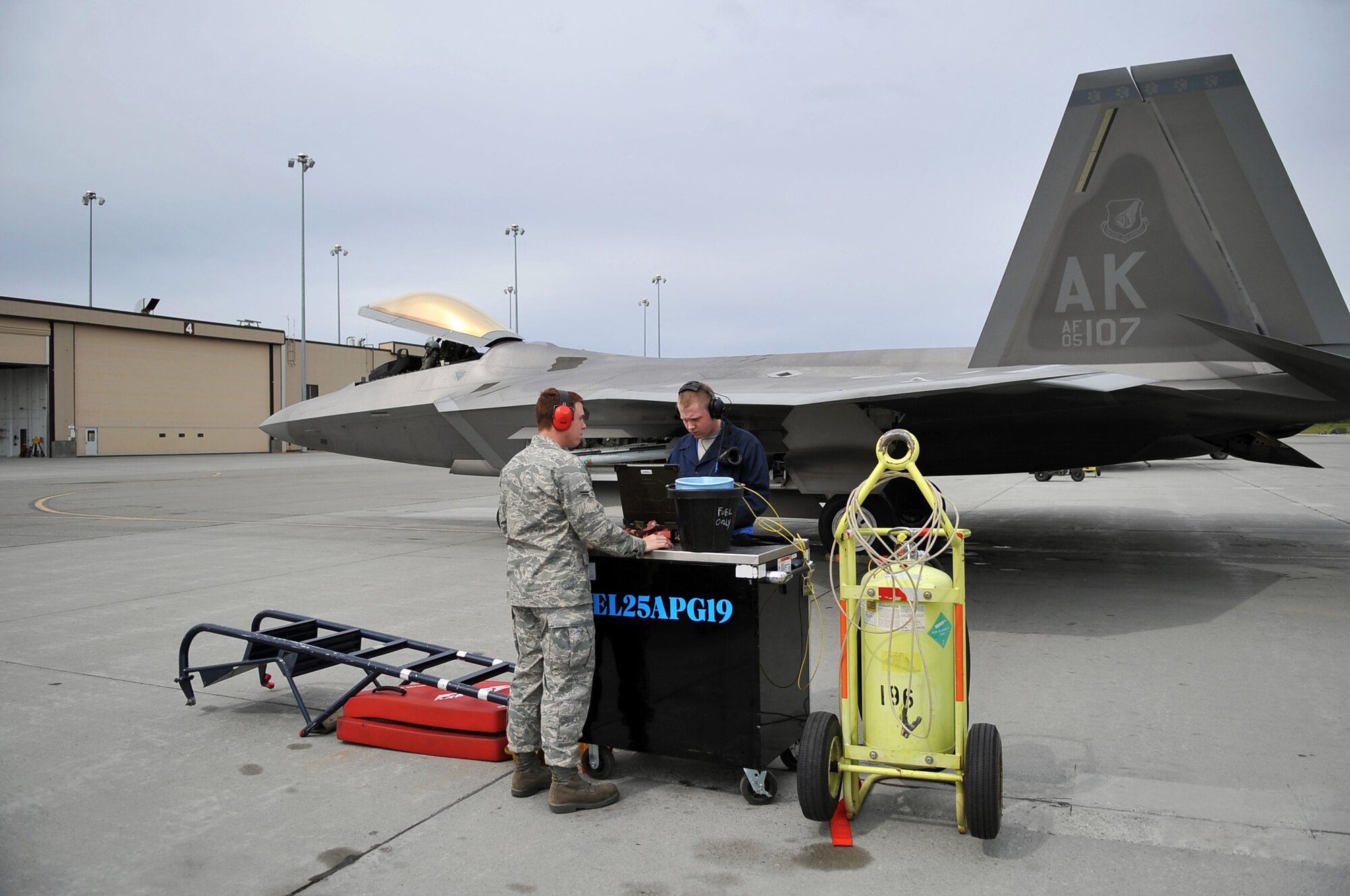 Airmen 1st Class Benjamin Keller and Shane Brewster prepare to launch their F-22 Raptor fighter aircraft for a mission June 17, 2009, during Northern Edge 09 held at Elmendorf Air Force Base, Alaska. The Airmen are from the 90th Fighter Squadron and 525th Aircraft Maintenance Unit at Elmendorf AFB. Northern Edge is Alaska's largest military training exercise that prepares joint forces to respond to crises throughout the Asia-Pacific region. (U.S. Air Force photo/Master Sgt. Shane A. Cuomo)
