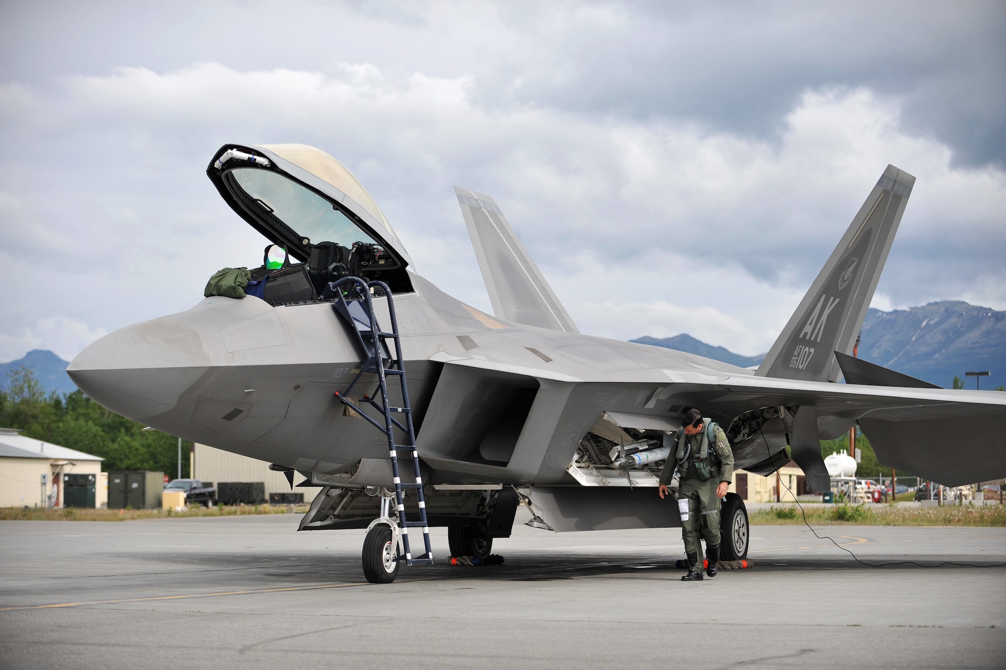 Lt. Col. John Hillyer conducts pre-flight checks on his F-22 Raptor fighter aircraft June 17, 2009, during Northern Edge 09 at Elmendorf Air Force Base, Alaska. Hillyer is the 477th Fighter Group commander at Elmendorf AFB. Northern Edge is Alaska's largest military training exercise that prepares joint forces to respond to crises throughout the Asia-Pacific region. (U.S. Air Force photo/Master Sgt. Shane A. Cuomo)