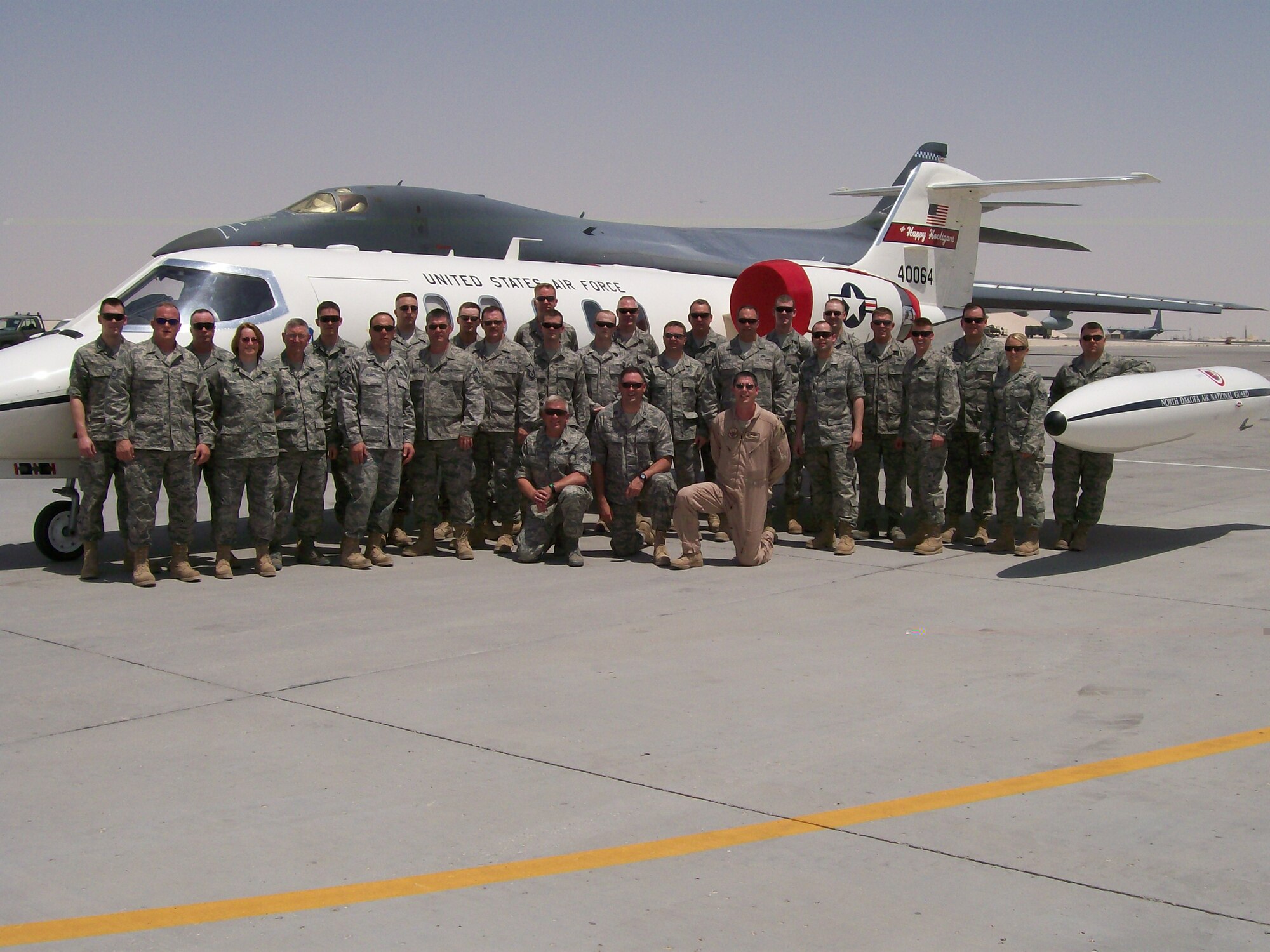 Airmen from the 119th Wing, North Dakota Air National Guard, stand in front of a C-21 Lear Jet in South West Asia.  For the first time in the history of the U.S. Central Command, the C-21s, the military version of the Learjet 35A, are being maintained by Airmen rather than contractors. 
