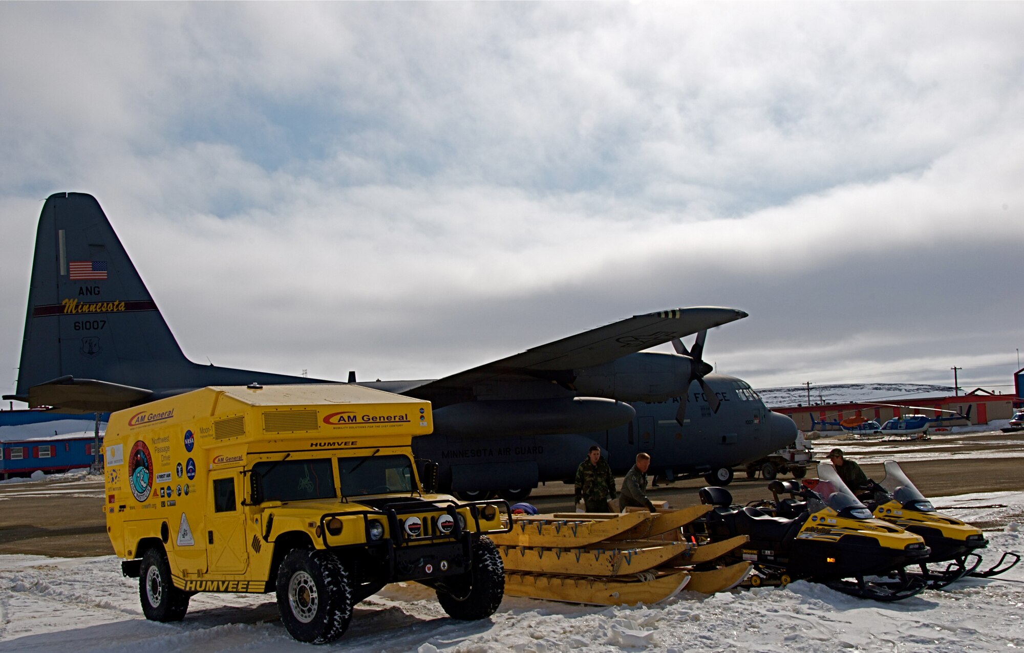 A 133rd Airlift Wing, Minnesota Air National Guard C-130 Hercules cargo aircraft in Cambridge Bay, Canada is being used to transport the Haughton-Mars Project Moon-1 Humvee Rover 28 May 2009.  HMP supports an exploration program aimed at developing new technologies, strategies, human's factors experience, and field-based operational know-how key to planning the future exploration of the Moon and Mars. The "Moon-1" can be seen with traditional tires for transportation while the tracks will be loaded separately which are needed for the adverse conditions the vehicle must through.
U.S. Air Force Photo by Tech Sgt Erik Gudmundson (Released)
