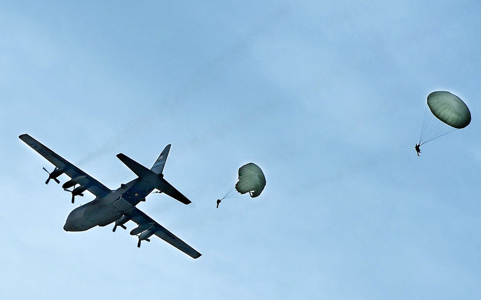 A C-130 Hercules drops 823rd Red Horse personnel during the Hydra Exercise 2009.  Hydra is a training exercise developed to provide a West Coast venue to train the 615 Contingency Response Wing's unique mission capabilities such as, command and control, aerial port, maintenance and air mobility liaison duties in a joint environment.  (U. S. Air Force photo/Master Sgt. Cecilio Ricardo)