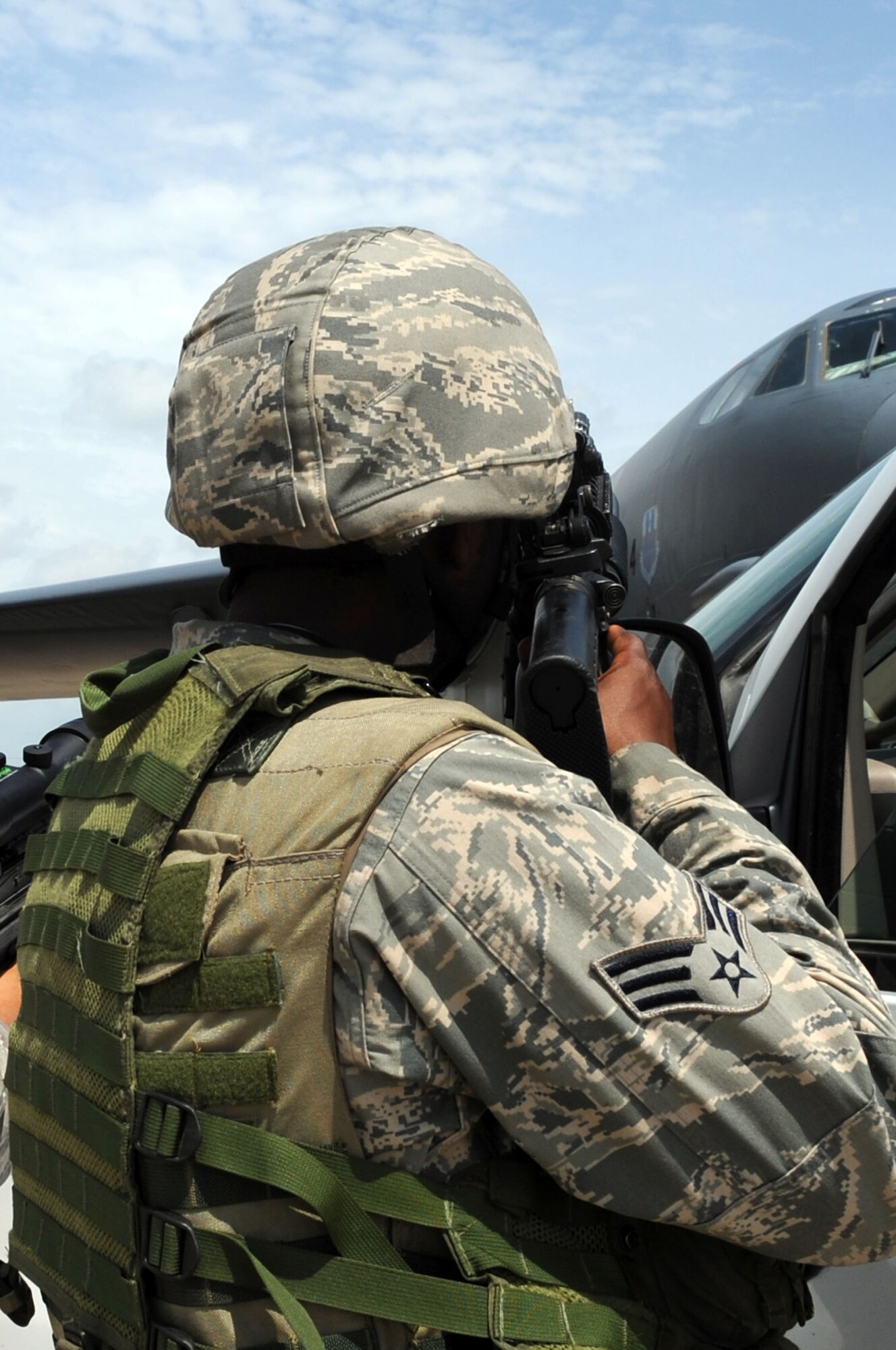 BARKSDALE AIR FORCE BASE, La. -- An Airman from the 2d Security Forces Squadron secures the outside of a B-52H Stratofortress during the Nuclear Surety Exercise June 10. An NSE is an exercise the 2d Bomb Wing uses to prepare for higher headquarters inspections.  (U.S. photo by Airman 1st Class Brittany Y. Bateman)