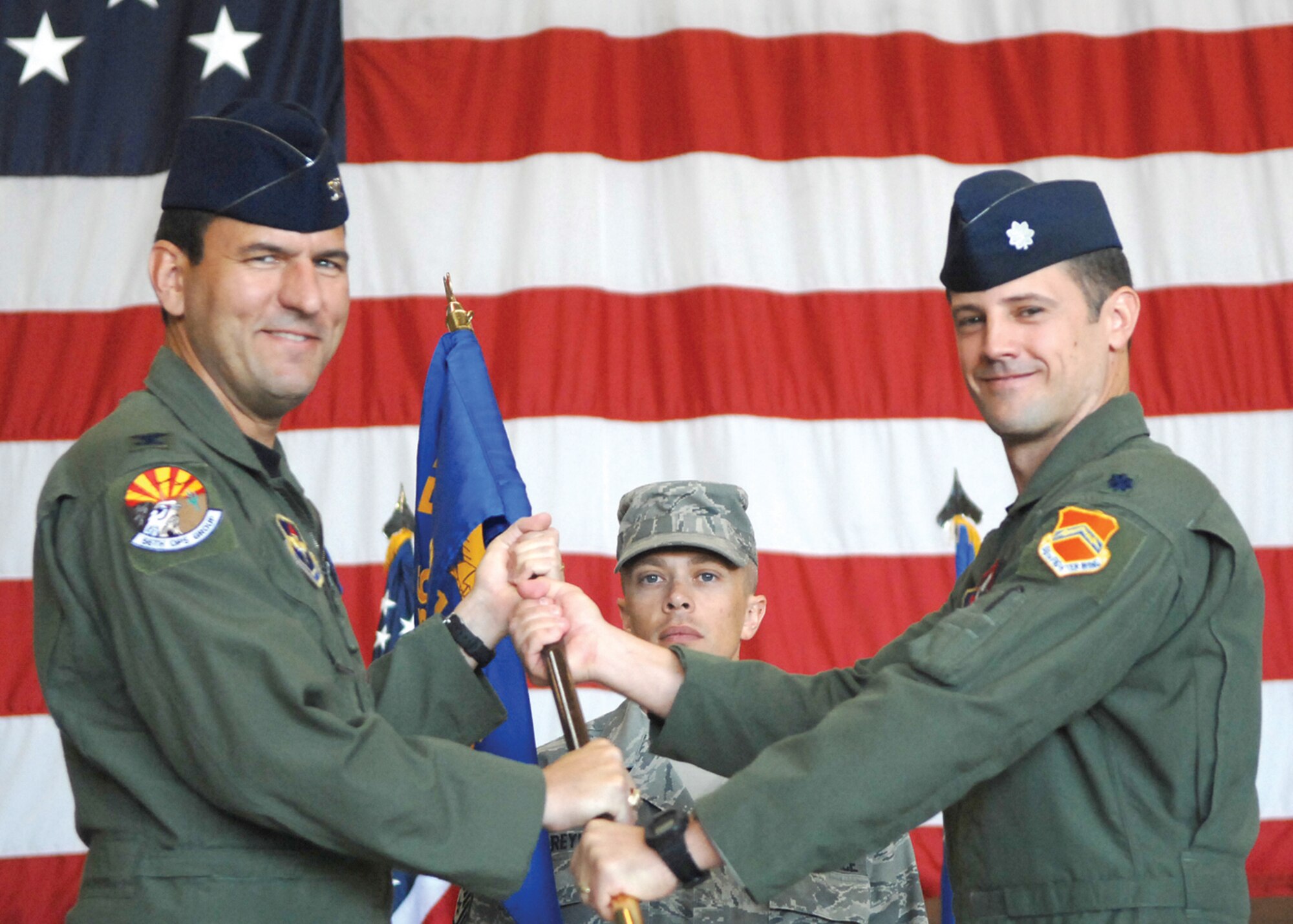 Lt. Col. William Bowman takes command of the 21st Fighter Squadron from Col. Pete Schaub, 56th Operations Group commander on Monday in Bldg. 408. (U.S. Air Force photo/ Tech. Sgt. Jeffrey Wolfe)