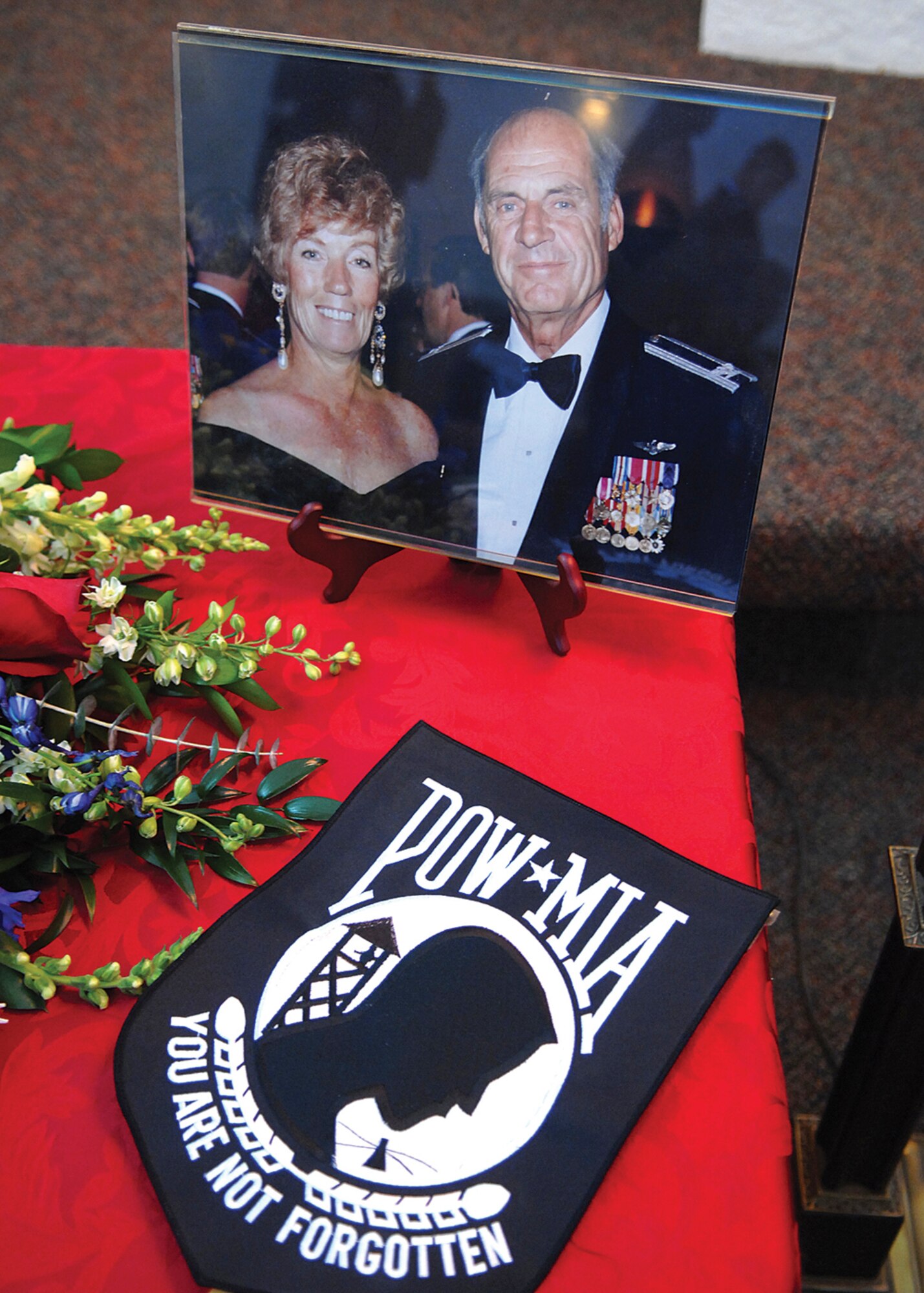 A photo of Colonel Bomar and his wife, Kay, sits on display during the memorial service. Colonel Bomar’s confinement during the Vietnam war spanned six years and one month. (U.S. Air Force photo/ Tech. Sgt. Jeffrey Wolfe)