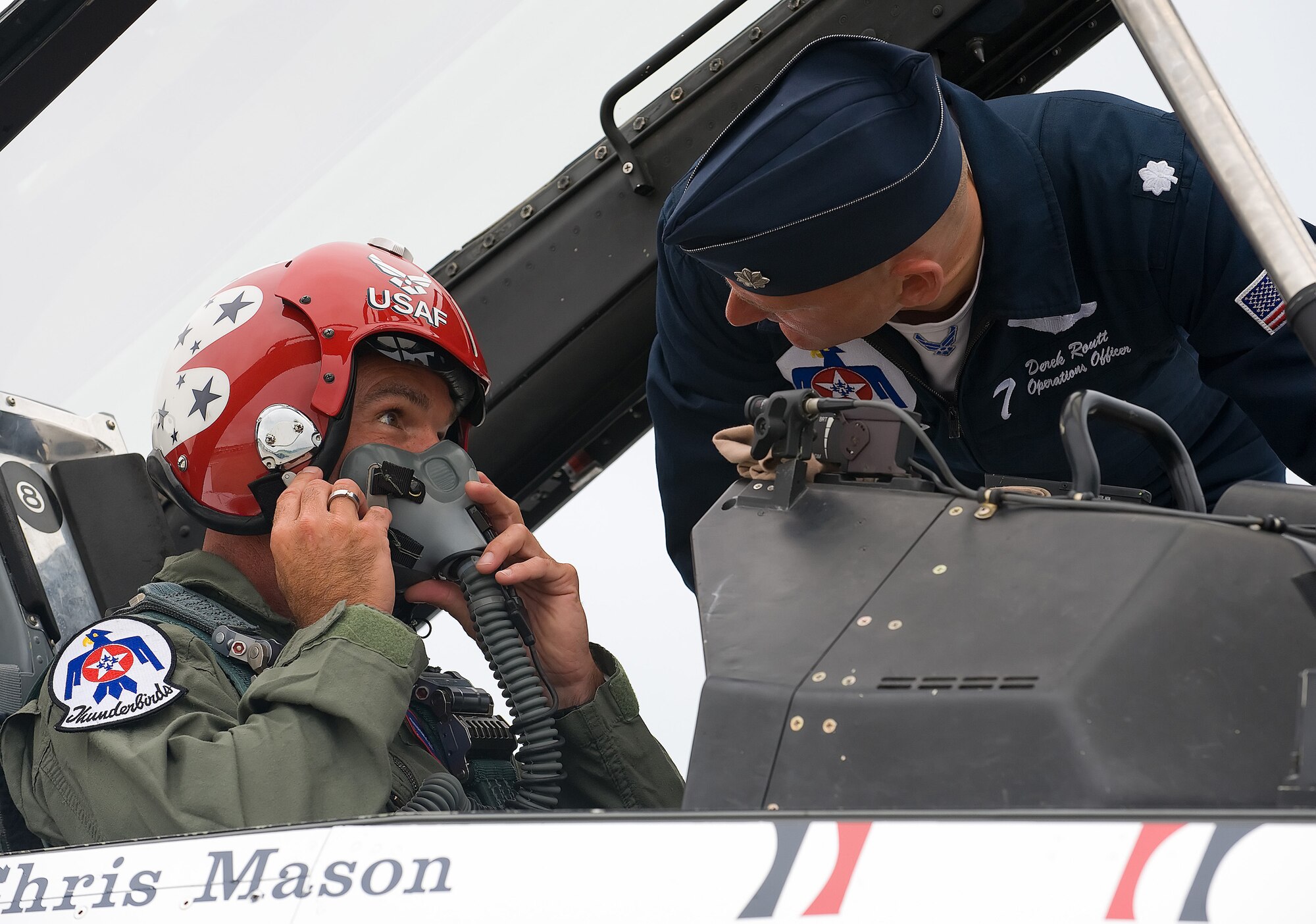 Lt. Col. Derek Routt, Thunderbirds Operations Officer, speaks with Mark Teesdale before the Hometown Hear flight at Dover Air Force Base June 18. The U.S. Air Force Thunderbirds aerial demonstration team selected Mr. Teesdale to fly with them June 19 as part of the Hometown Heroes program. Mr. Teesdale is a general music and chorus teacher at Lake Forest Central Elementary School in Felton and is the 2009 Delaware Teacher of the Year. (U.S. Air Force photo/Tom Randle)