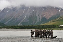 A group of Navy SEALs prepares to cross Phelan Creek during NORTHERN EDGE 2009, June 17. NE09 is a large scale exercise hosted in Alaska to improve command, control and communications between the Armed Services. The Northern Warfare Training Center and the SEALs worked together on river crossing techniques and rope handling. (U.S. Air Force photo/Staff Sgt. Christopher Boitz)