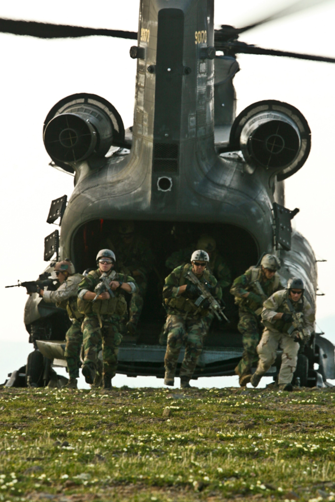 FORT WAINWRIGHT, Alaska -- Operators from a west-coast based Navy SEAL team participated in infiltration and exfiltration training as part of Northern Edge 2009 June 15, 2009. Army Task Force 49, 1-52 Aviation Regiment, B company, transported the SEALS in CH-47D "Chinook" helicopters, performing two-wheel landings atop mountainous terrain in the Joint Pacific Alaska Range Complex. Exercise Northern Edge is a training exercise designed to promote and improve interoperability.
(U.S. Marine Corps Photo/Lance Cpl. Ryan Rholes)
