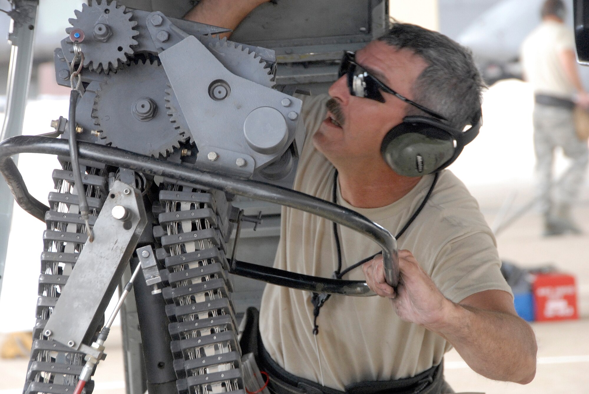 Master Sgt. William Porterfield attaches the ammunition-loading assembly to an A-10 Thunderbolt II during a weapons-load competition at Whiteman Air Force Base, Mo. The competition is designed to hone the loaders' skills in safely and quickly rearming an A-10 after a combat sortie. Sergeant Porterfield is an Air Force reservist in the 442nd Aircraft Maintenance Squadron, part of the 442nd Fighter Wing, based at Whiteman. (U.S. Air Force photo/Senior Airman Danielle Wolf)