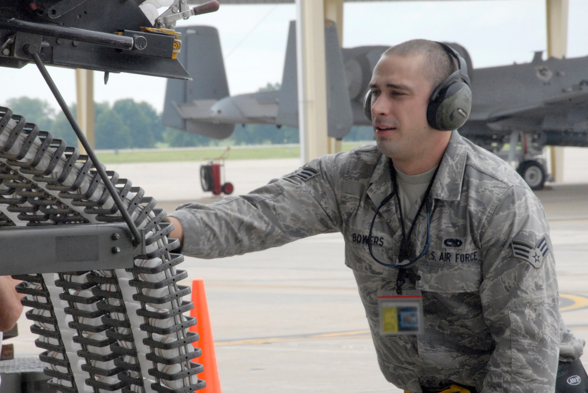 Airman 1st Class Clinton Bowers positions an ammunition loading assembly during an A-10 Thunderbolt II weapons-load competition at Whiteman Air Force Base, Mo. The competition is designed to hone the loaders' skills in safely and quickly rearming an A-10 after a combat sortie. Airman Bowers is an Air Force reservist in the 442nd Aircraft Maintenance Squadron, part of the 442nd Fighter Wing, based at Whiteman. (U.S. Air Force photo/Senior Airman Danielle Wolf)