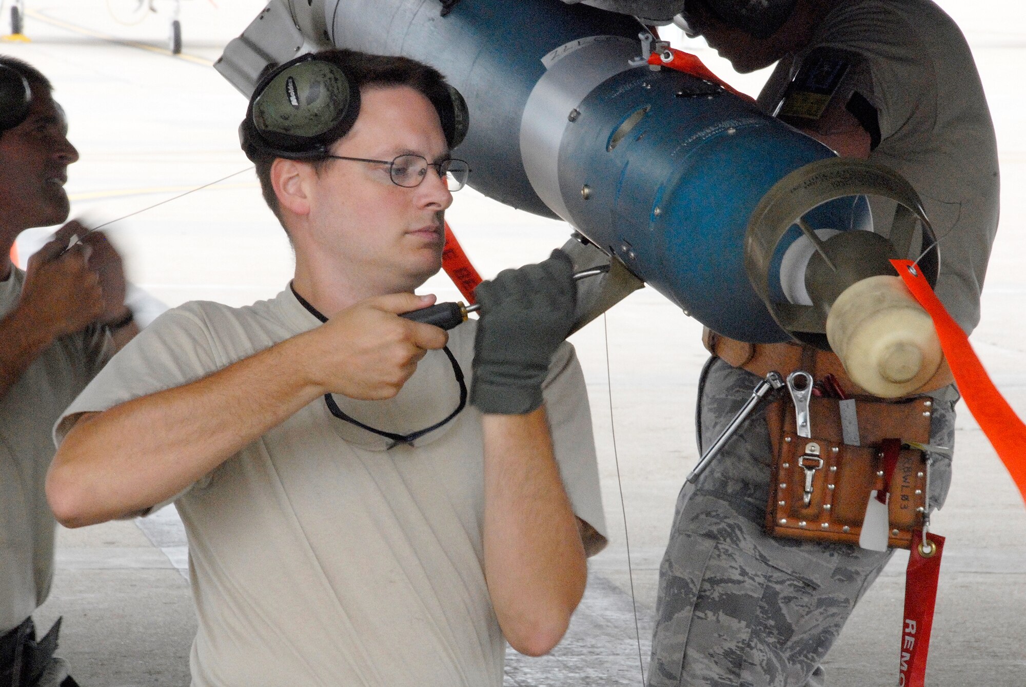 Senior Airman Richard Fennewald attaches a guidance-control unit to a Mark-82 laser-guided bomb during an A-10 Thunderbolt II weapons-load competition at Whiteman Air Force Base, Mo. The competition is designed to hone the loaders' skills in safely and quickly rearming an A-10 after a combat sortie. Airman Fennewald is an Air Force reservist in the 442nd Aircraft Maintenance Squadron, part of the 442nd Fighter Wing, based at Whtieman. (U.S. Air Force photo/Senior Airman Danielle Wolf)