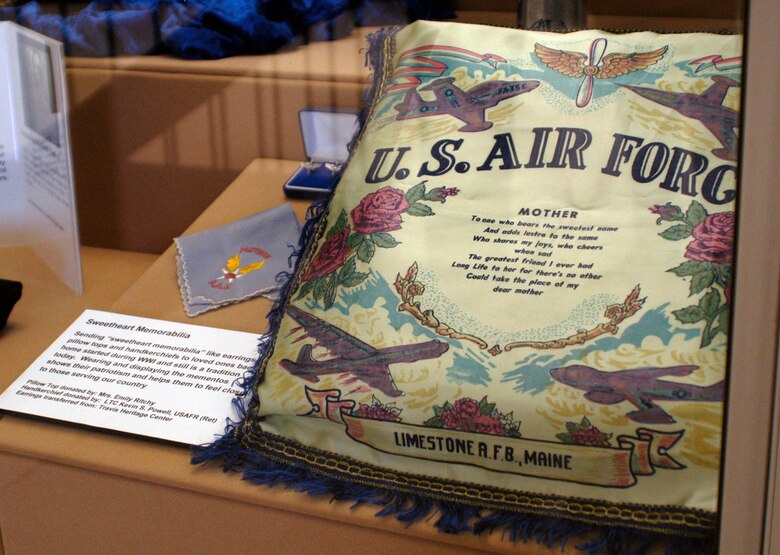 Sending “sweetheart memorabilia” like earrings, pillow tops and handkerchiefs to loved ones back home started during World War I and still is a tradition today. Wearing an displaying the mementoes shows their patriotism and helps them to feel close to those serving our country. (U.S. Air Force photo)