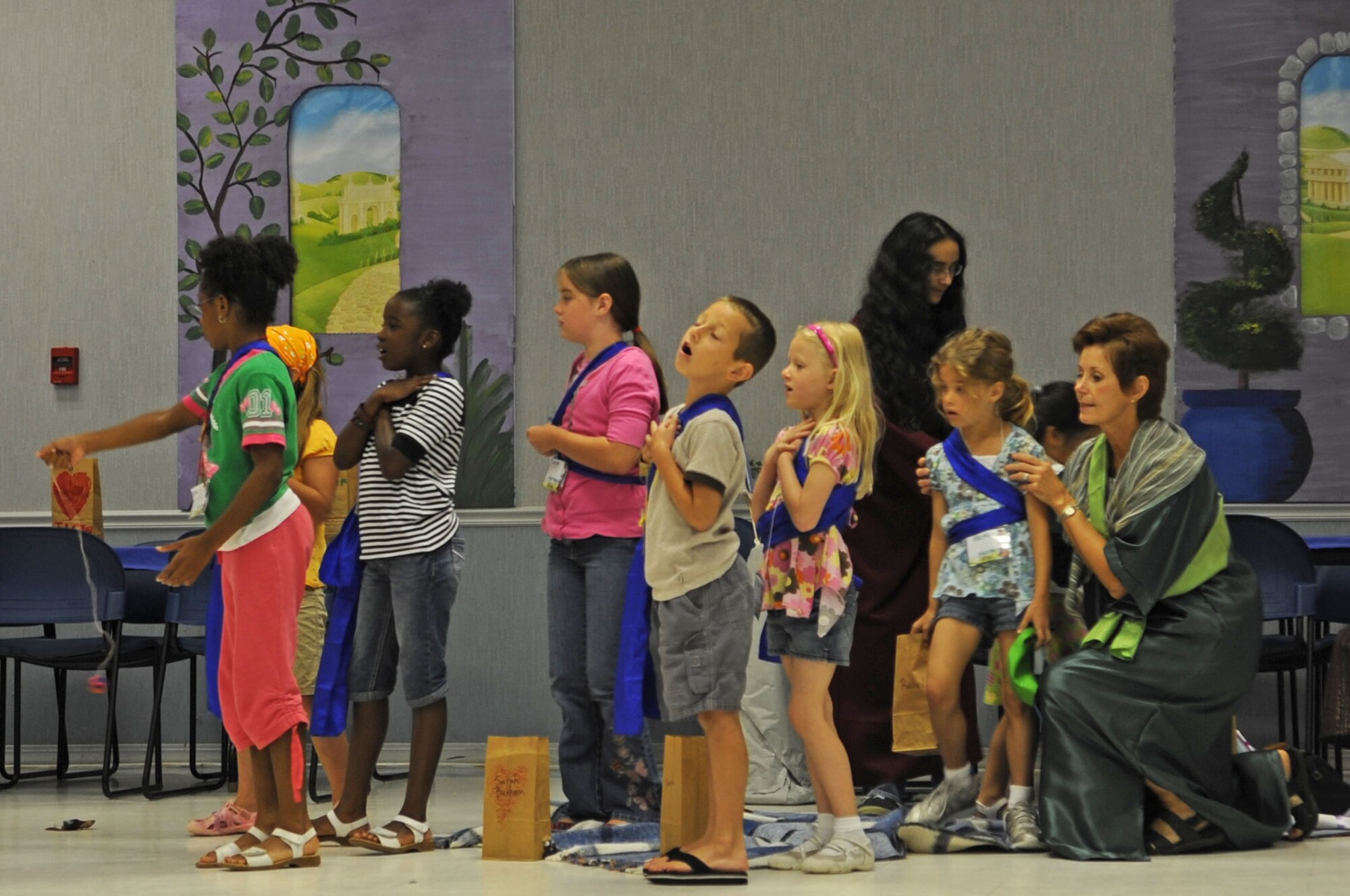 BARKSDALE AIR FORCE BASE, La. -- Children sing along with their teacher during Vacation Bible School June 11. Vacation Bible School was held at the Chapel 2 Annex throughout June. (U.S. photo/ Airman 1st Class Brittany Y. Bateman)