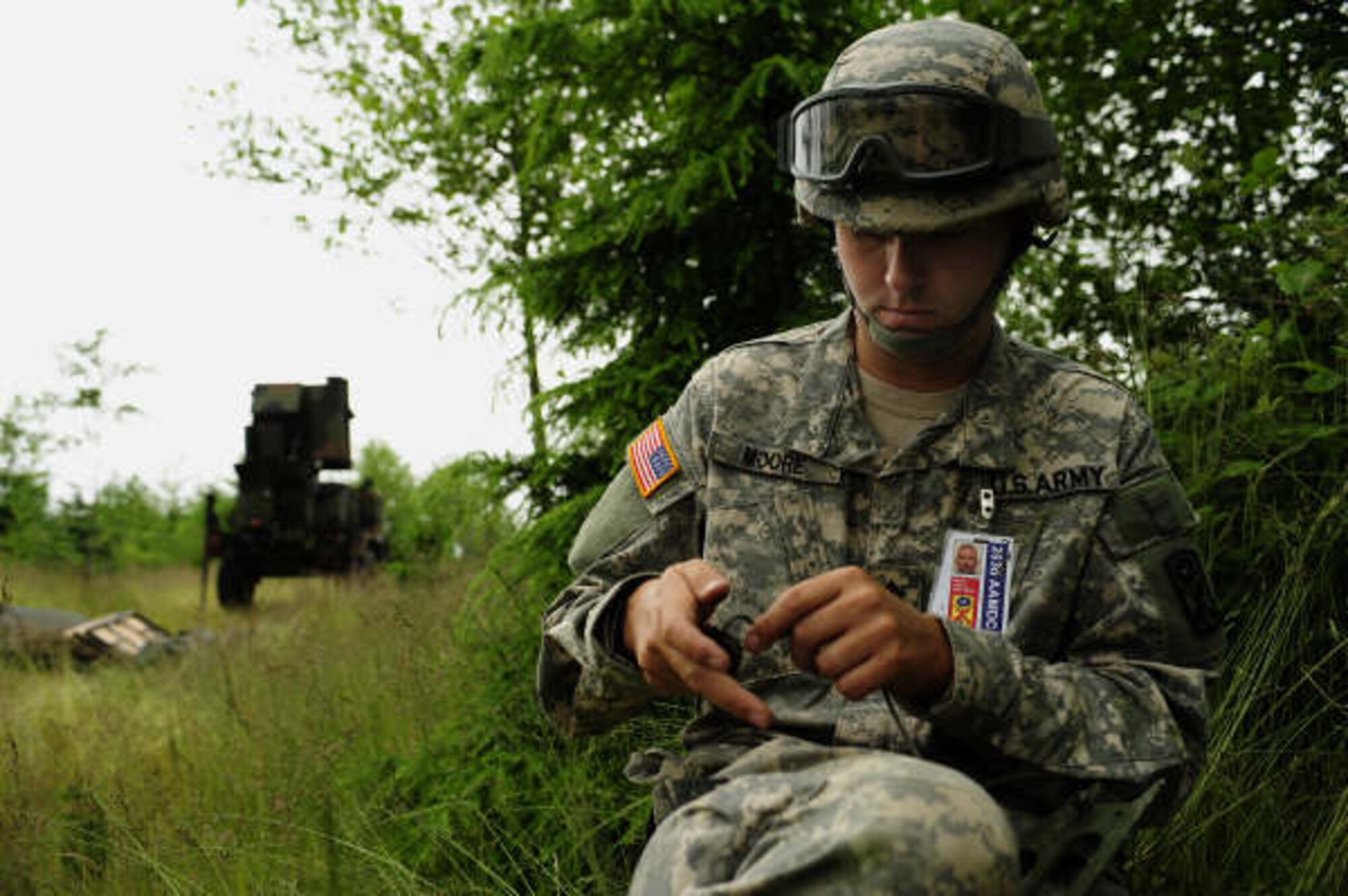 U. S. Army Staff Sgt. John Moore, Radar Maintenance and Operations Technicians, 263rd Anti-Air Missile Defense Command, South Carolina National Guard, prepares to secure a antenna stabilization wire into the ground from a radar antenna during Exercise Amalgam Dart, near Camp Rilea OR, June 14, 2009.  (U.S. Air Force photo by Technical Sgt. Sean M. Worrell)