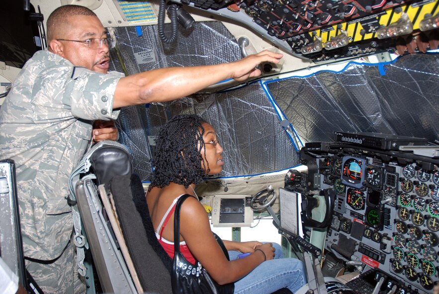 Master Sgt. Floyd Stanfield, 94th Maintenance Group. shows the cockpit of a C-130 static display to a student with the Atlanta Chapter Tuskegee Airman summer camp June 17. More than 20 children toured Dobbins ARB to learn about careers within the Air Force Reserves.