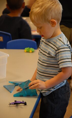 Jaiden Johnson, 3, plays with toys June 17 at the CDC. The CDC provides all the tools necessary for an educational, yet fun, learning experience for the children.(Photo by Airman 1st Class Chuck Broadway)