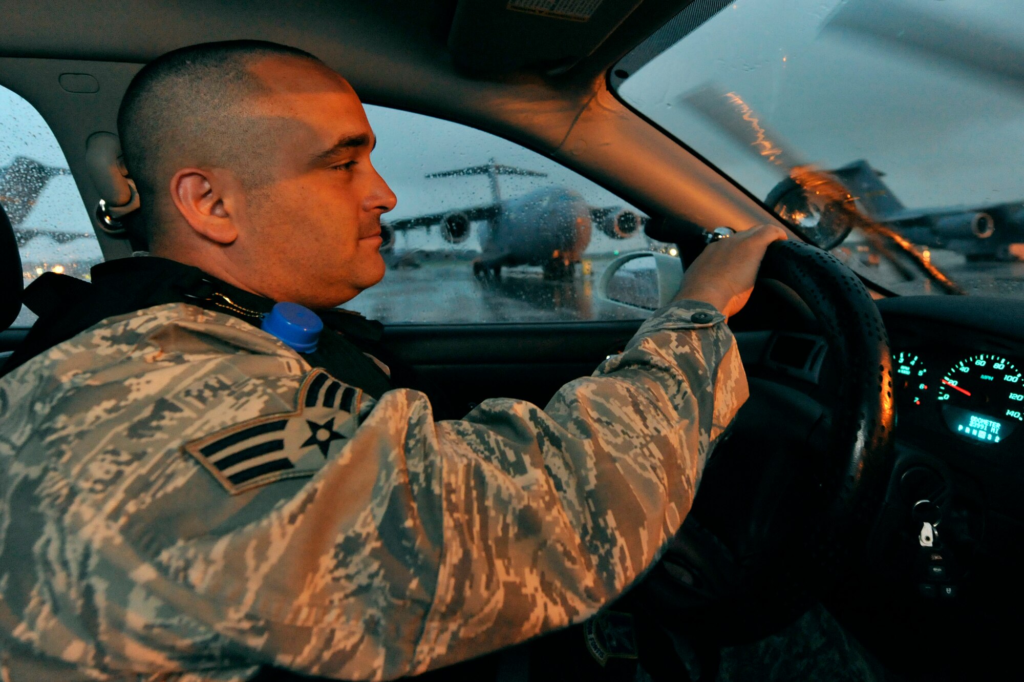 Senior Airman Neil White patrols the mass parking area on the flightline June 18, 2009, at Charleston Air Force Base, S.C. Airman White is a patrolman with the 437th Security Forces Squadron.  (U.S. Air Force photo/James M. Bowman) (RELEASED)