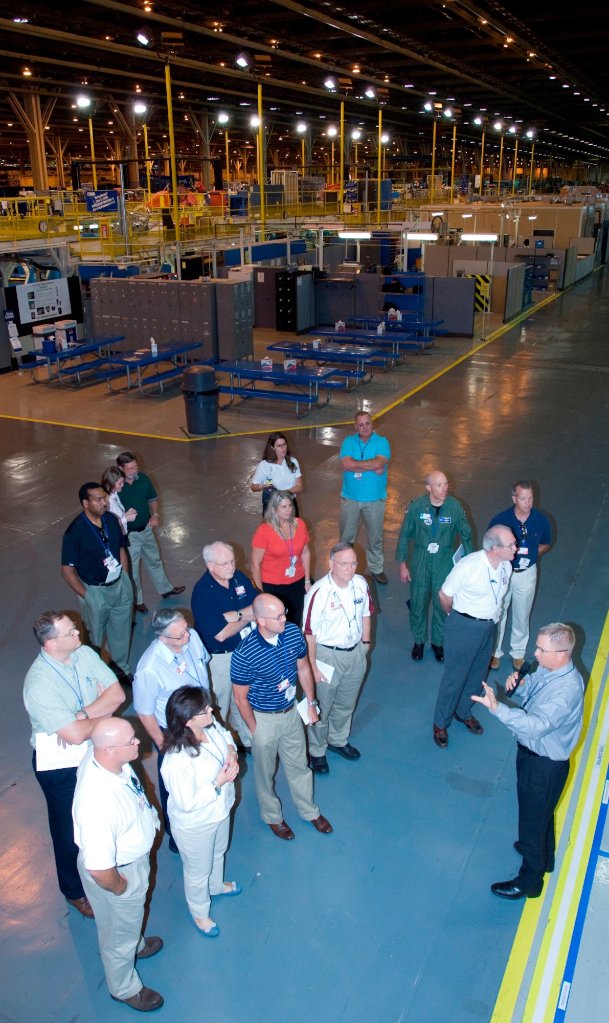 More than 20 civic leaders from communities around Arnold Engineering Development Center (AEDC) departed the base June 11 for a two-day community relations tour to Lockheed Martin in Marietta, Ga., and nearby Robins Air Force Base (AFB). Here, Scott Eads, Lockheed Martin F-22 production senior manager at at Marietta, Ga., production facility, shows the group how the F-22A Raptor’s manufacturing process works on the assembly floor, shifting the end product from one station to the next via a rail system eliminating any suspension of the fuselage and maximizing the production efficiency. (Photo courtesy of Lockheed Martin)