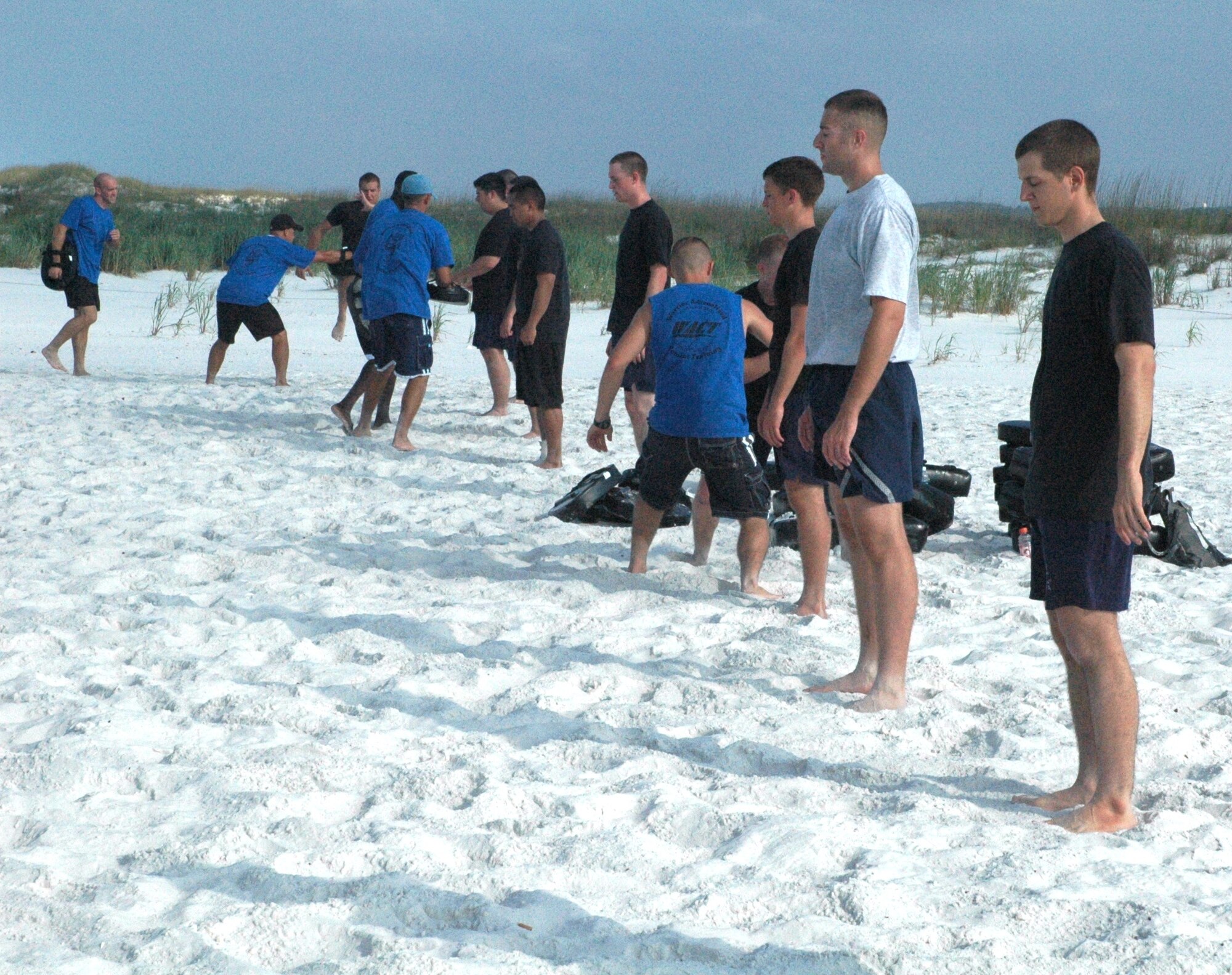 Trainers from the 325th Security Forces Squadron conduct Warrior Adrenalized Combat Training with Academy cadets during their visit to Tyndall AFB June 17 at the beach on base. The cadets are part of Operation Air Force, a three-week program designed to give cadets the opportunity to experience firsthand everything an operational Air Force base has to offer.  (U.S. Air Force photo/Airman 1st Class Veronica McMahon)