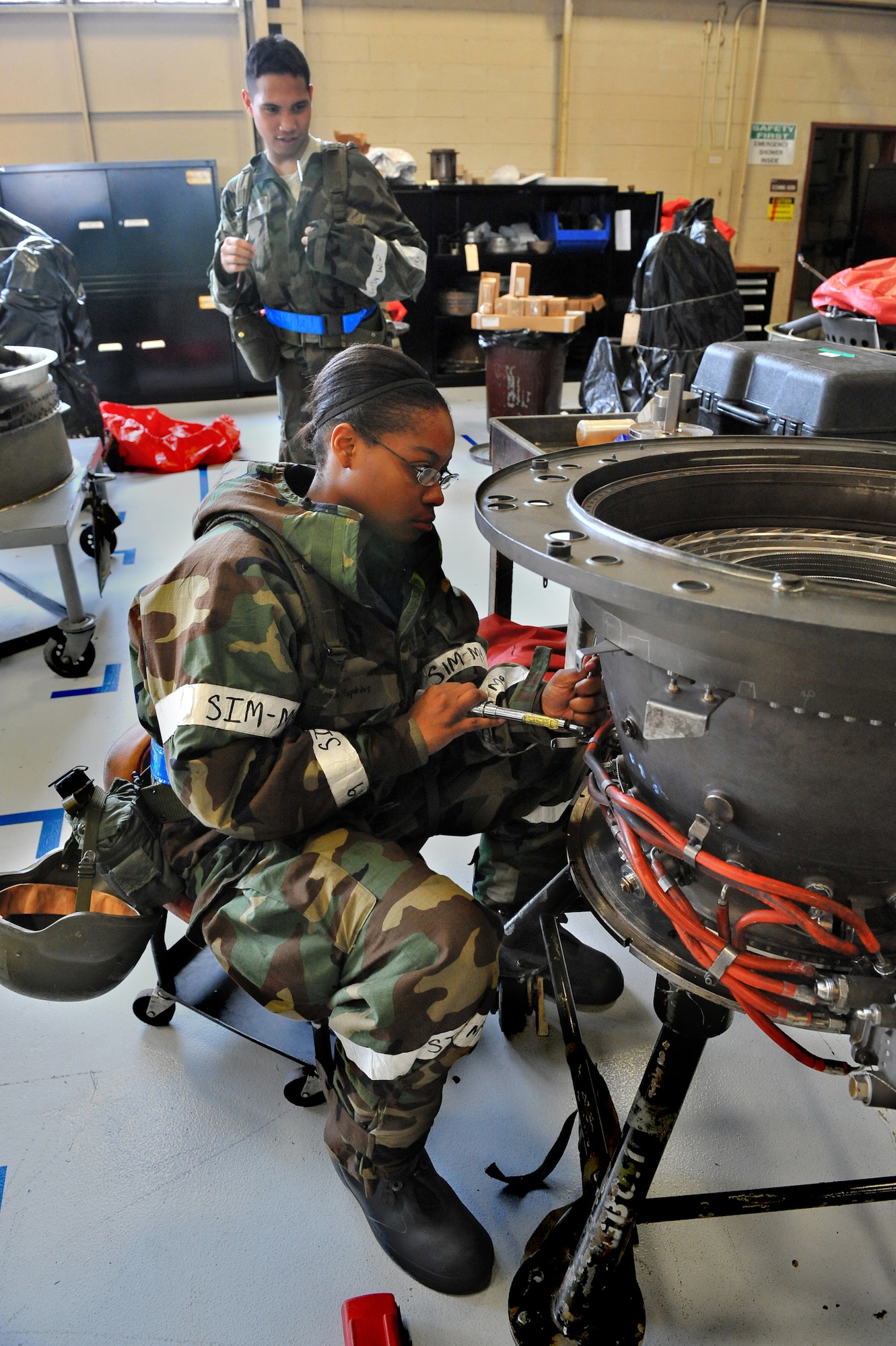 SHAW AIR FORCE BASE, S.C. -- Airman Melshondra Hopkins, 20th Component Maintenance Squadron, torques the bolts on a combustion frame during Team Shaw's operational readiness inspection, June 17. The ORI will evaluate the training and preparedness of Shaw Airmen for homeland attack and worldwide deployment. (U.S. Air Force photo/Senior Airman Kathrine McDowell)
