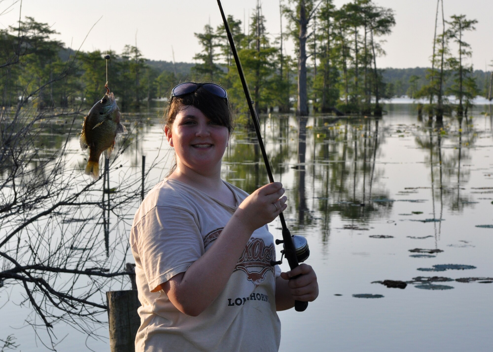 Delaney Steele, 12, shows off her fishing abilities at Flag Lake on the East Reservation of Barksdale Air Force Base, La., June 13, 2009. Delaney and her two brothers were on a family fishing trip with their father Master Sgt. Greg Steele, 47th Fighter Squadron, visual information technician, who decided to utilize one of the many recreational opportunities offered on Barksdale for the family outing. Sergeant Steele is an Air Reserve Technician with the 47th FS. (Courtesy photo)