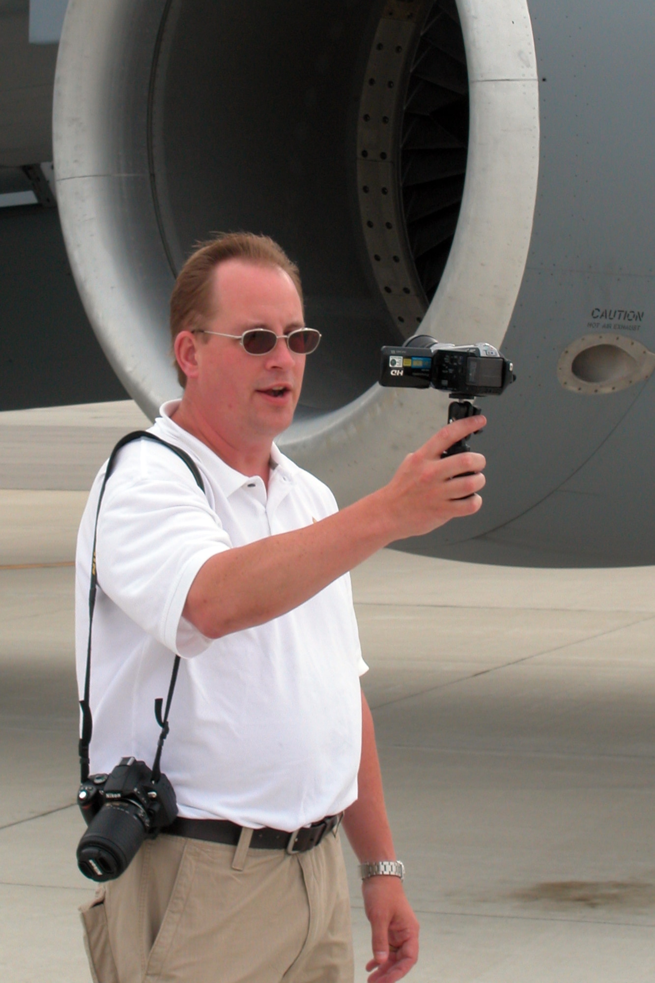 GRISSOM AIR RESERVE BASE, Ind., -- Steve Tupper, producer and host of Airspeed, and online website devoted to aviation enthusiasts, records himself as part of a segment he's producing on aerial refueling. Mr. Tupper and other media members had an opportunity to participate in a refueling mission between a Grissom KC-135R Stratotanker and a C-17 Globemaster from Charleston AFB, S.C. (U.S. Air Force photo/Tech. Sgt. Doug Hays)