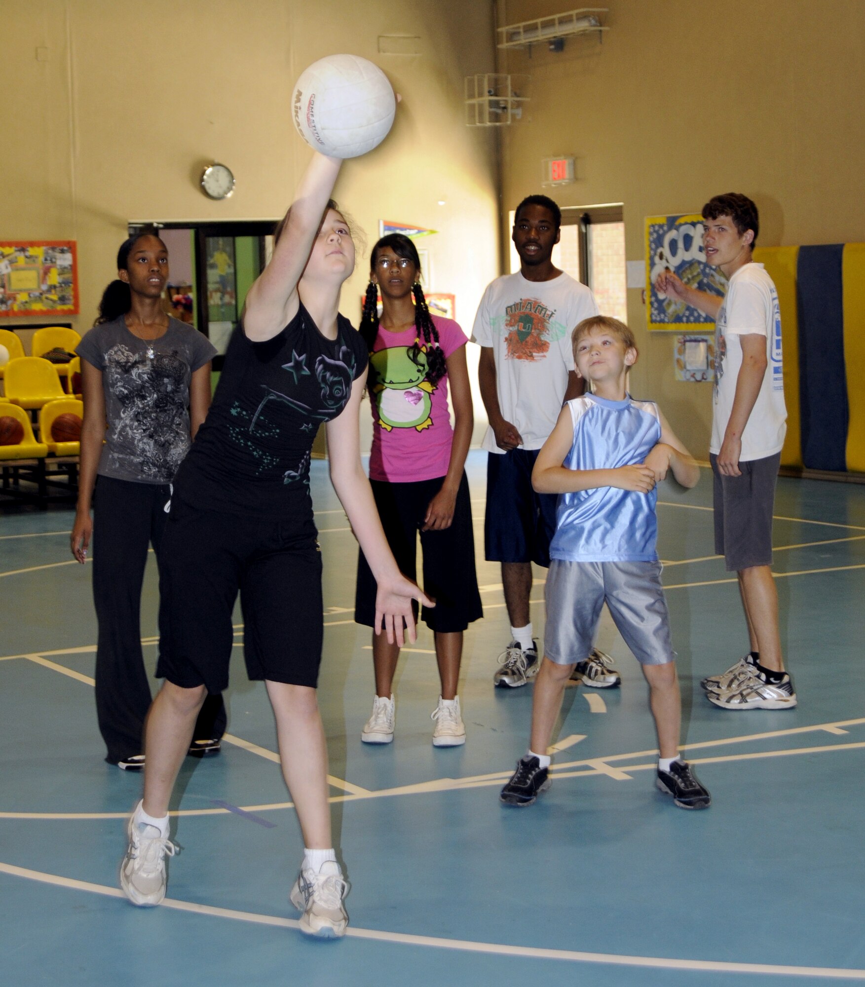 Katie Kaya, daughter of Elizabeth Kaya, 39th Communications Squadron, practices spiking the volleyball at the wall as her peers watch during the Youth Program’s volleyball camp Tuesday, June 16, 2009 at Incirlik Air Base, Turkey. The camp, which runs the entire week, is just one on a list of several camps and recreation trips available for children during their summer. Call YP at 676-6670 for more information about activities.  (U.S. Air Force photo/Airman 1st Class Amber Russell)