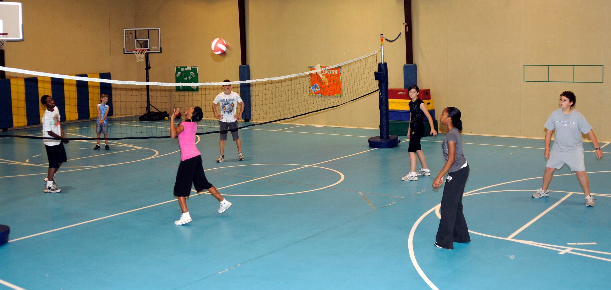 Youth practice their skills acquired during the Youth Program’s volleyball camp, in a four-on-four volleyball game Tuesday, June 16, 2009 at Incirlik Air Base, Turkey. The camp, which runs the entire week, is just one on a list of several camps and recreation trips available for children during their summer. Call YP at 676-6670 for more information about activities.  (U.S. Air Force photo/Airman 1st Class Amber Russell)