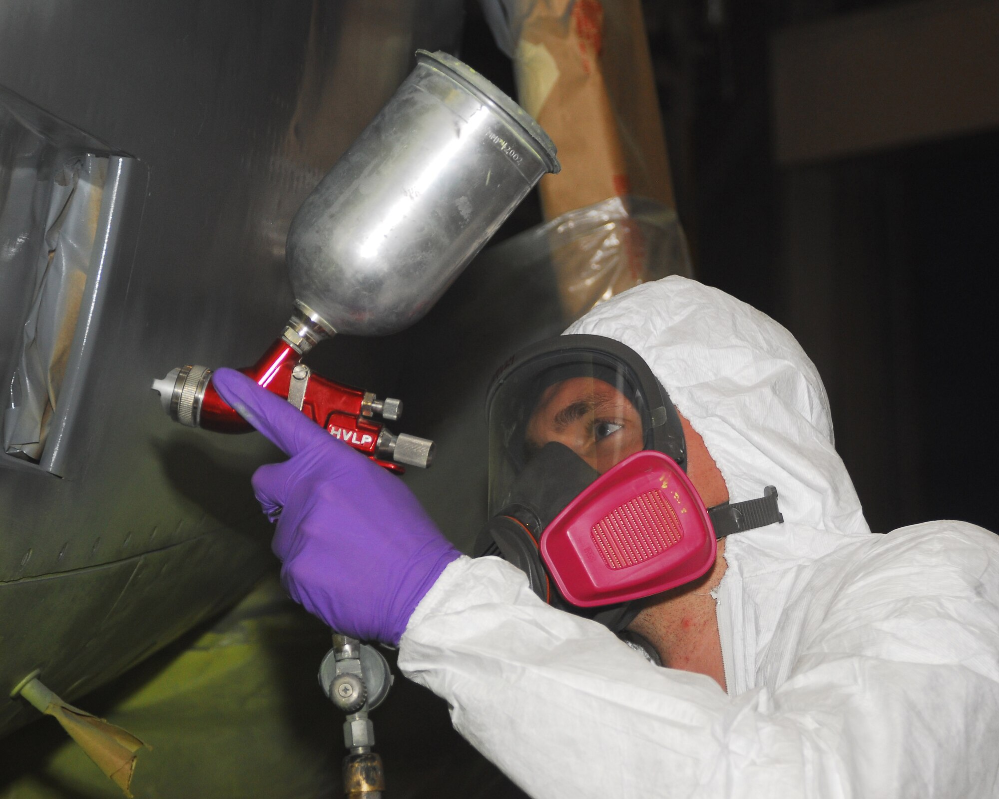 YOKOTA AIR BASE, Japan -- Airman 1st Class Christopher Patton, 374th Maintenance Squadron fabrication flight refurbishing section, paints a C-130 engine June 18. The engine needed a new coat of grey paint to match other panels on the aircraft. Painting is the last step in the refurbishing process before the engine is reinstalled. (U.S. Air Force photo/Airman Sean Martin) 