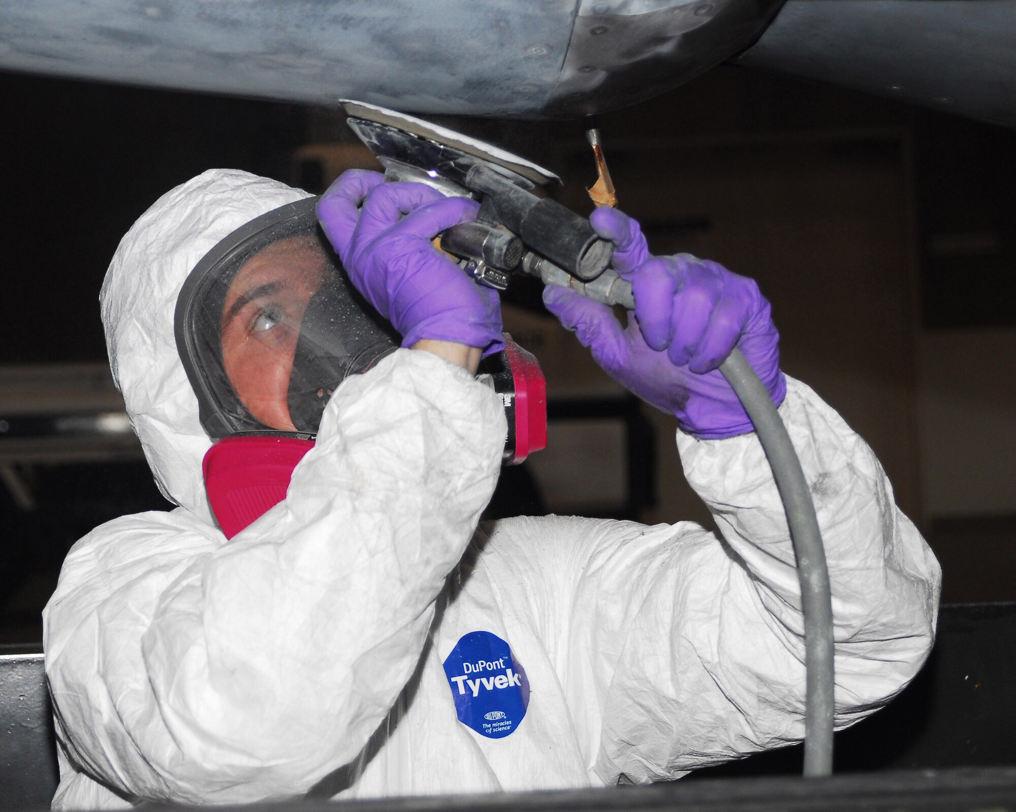 YOKOTA AIR BASE, Japan -- Airman 1st Class Aaron Schrock, 374th Maintenance Squadron fabrication flight refurbishing section, sands a C-130 engine before applying a fresh coat of paint June 18. Sanding the engine is one of the eight steps in the refurbishing process. The engine will be reinstalled after the refurbishing process is complete, thus making the aircraft mission ready. (U.S. Air Force photo/Airman Sean Martin)