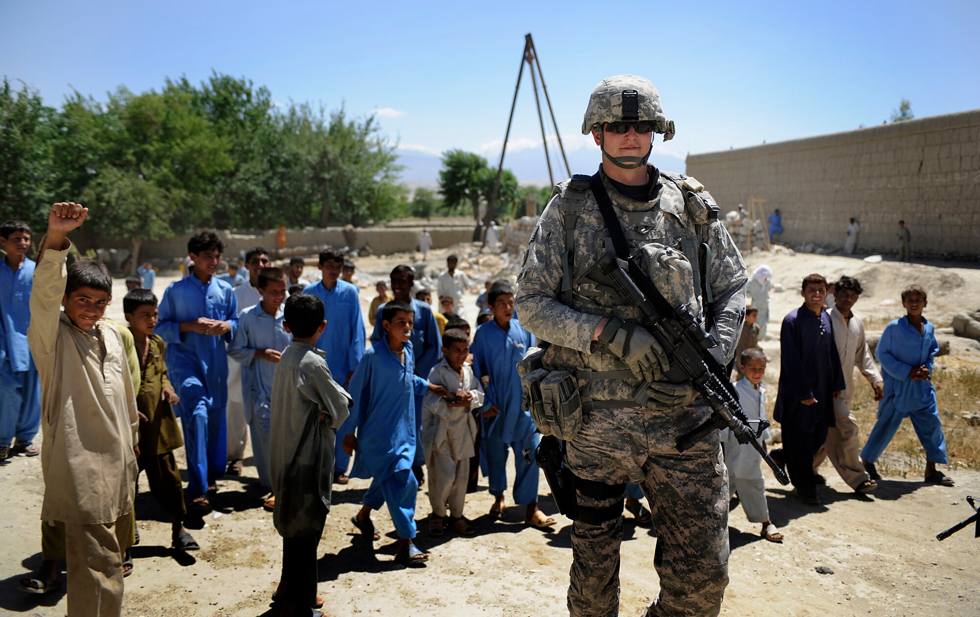 Staff Sgt. Richard Robison, Nangarhar Agri-Business Development Team, Forward Operating Base Finley-Sheilds, provides security during an agricultural assessment operation in Nangarhar Province, Afghanistan, May 28, 2009. The Nangarhar Agri-Business Development Team is responsible for developing and monitoring projects which will impact the agricultural needs of the rural farming communities in the province. The team supports the construction of wells, karizes, veterinary clinics, reforestation projects to name a few. Sergeant Robison is deployed from the 139th Security Forces Flight, 139th Airlift Wing, Missouri Air National Guard. (U.S. Air Force photo by Staff Sgt. Shawn Weismiller)


