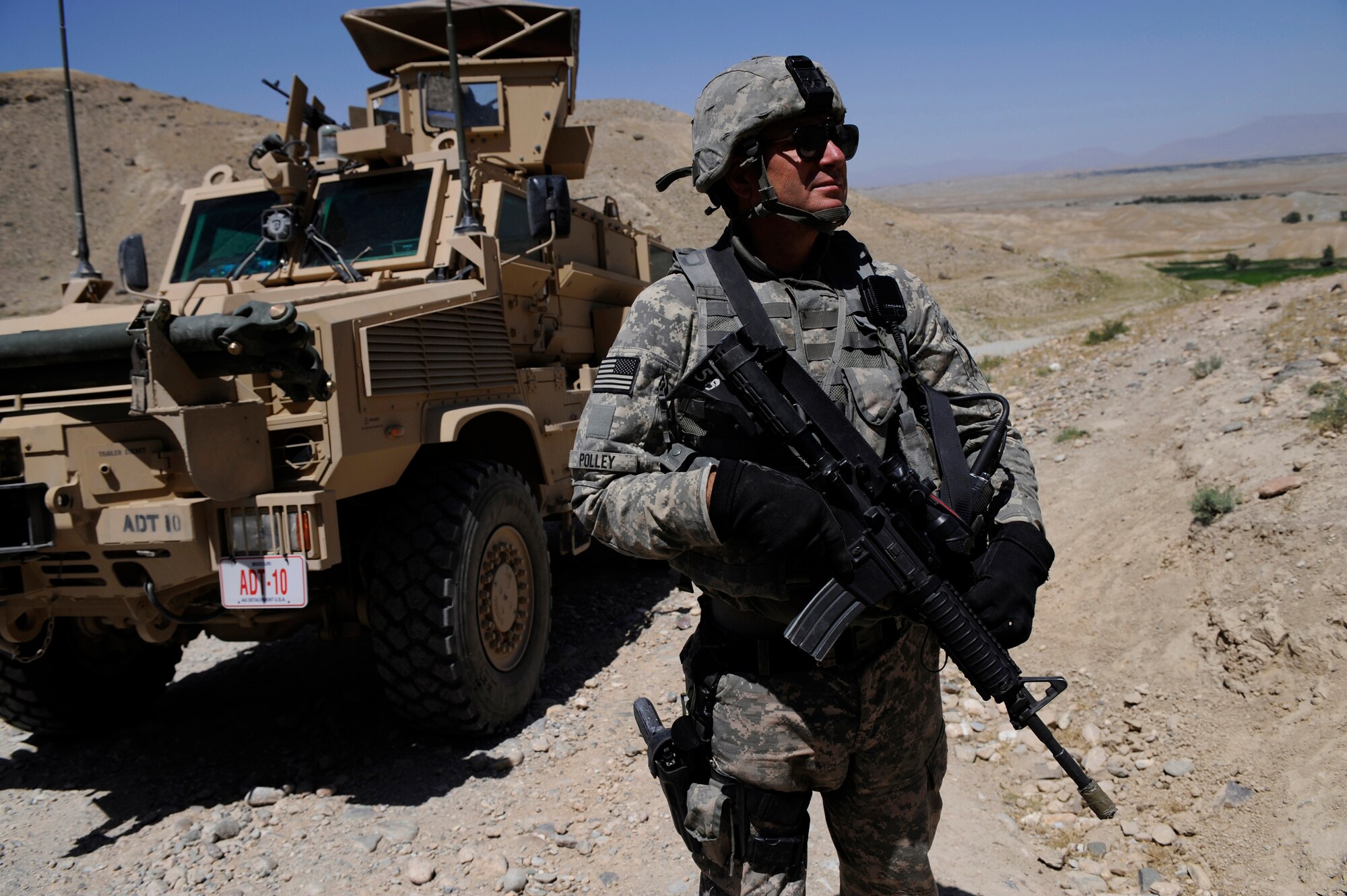 Tech. Sgt. Terry Polley, Nangarhar Agri-Business Development Team, Forward Operating Base Finley-Sheilds, provides security during an agricultural assessment operation in Nangarhar Province, Afghanistan, May 28, 2009. The Nangarhar Agri-Business Development Team is responsible for developing and monitoring projects which will impact the agricultural needs of the rural farming communities in the province. The team supports the construction of wells, karizes, veterinary clinics and reforestation. Sergeant Polley is deployed from the 139th Security Forces Flight, 139th Airlift Wing, Missouri Air National Guard. (U.S. Air Force photo by Staff Sgt. Shawn Weismiller)


