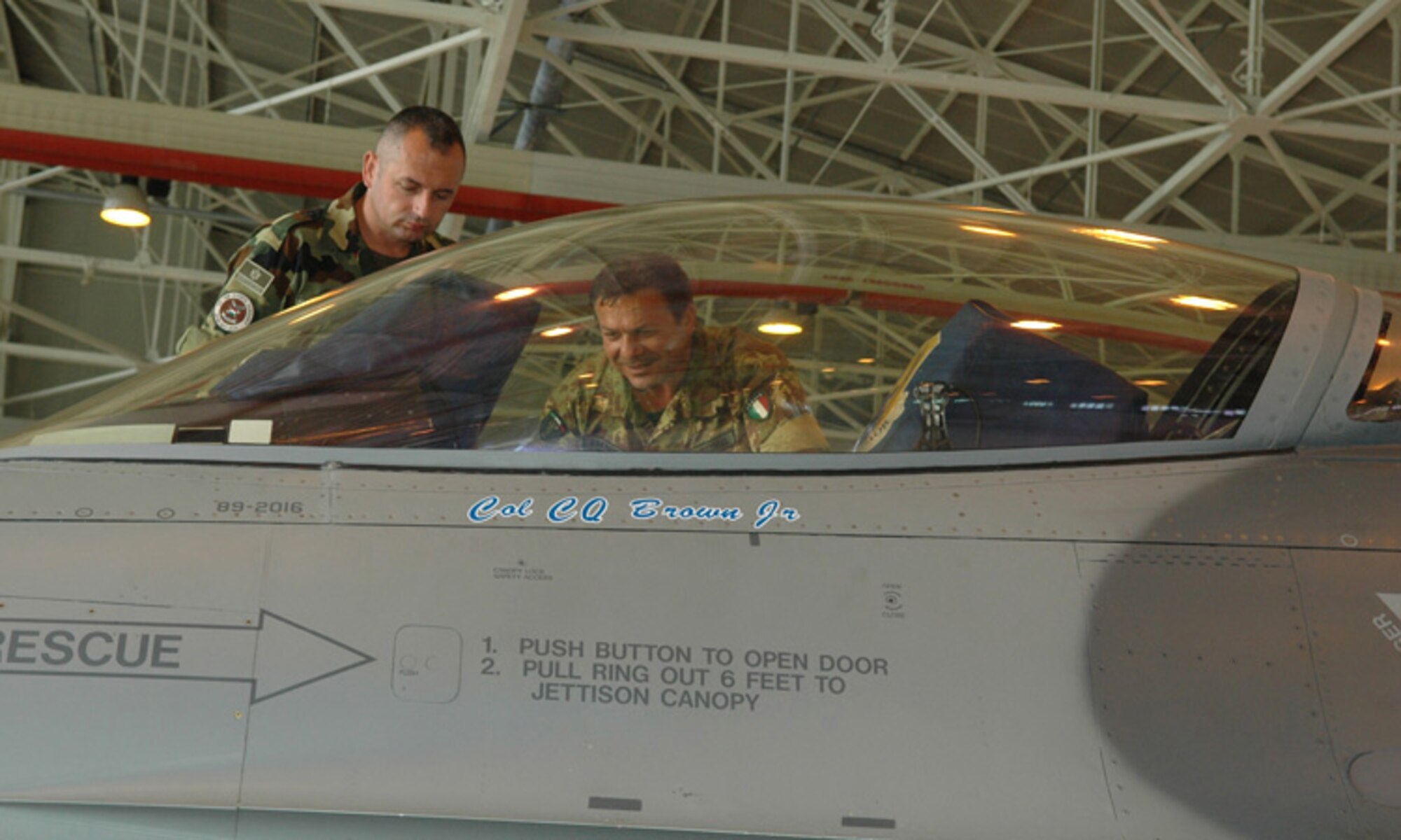 Members of the Italian Army look inside a U.S. Air Force F-16 Fighting Falcon during a visit to Aviano Air Base, Italy, June 11, 2009. The visit is part of the Vienna Document 1999. The purpose of VDOC99 is to build mutual trust and understanding among the participating states through data exchanges and on-site inspections.  (U.S. Air Force photo/Staff Sgt. Mercedes Crossland)
